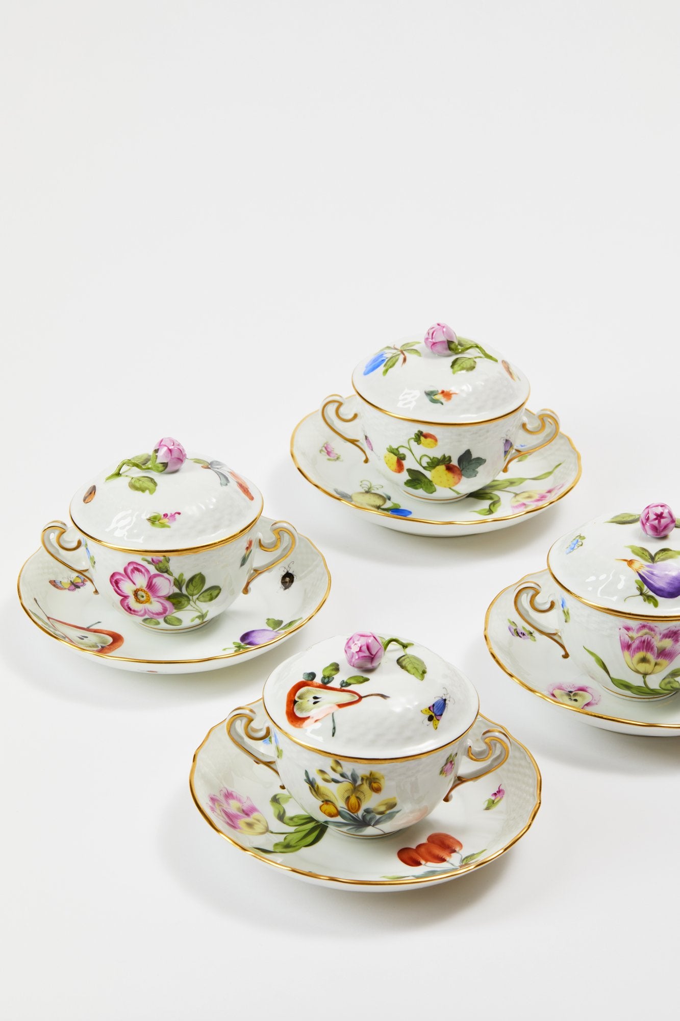 Market Garden designs on porcelain. Five piece place setting includes dinner plate, dessert plate, bread & butter plate and tea cup with saucer.