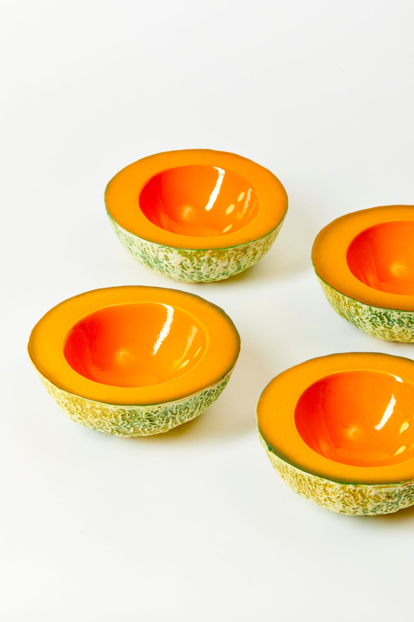 Bowls in the shape of cantaloupe.