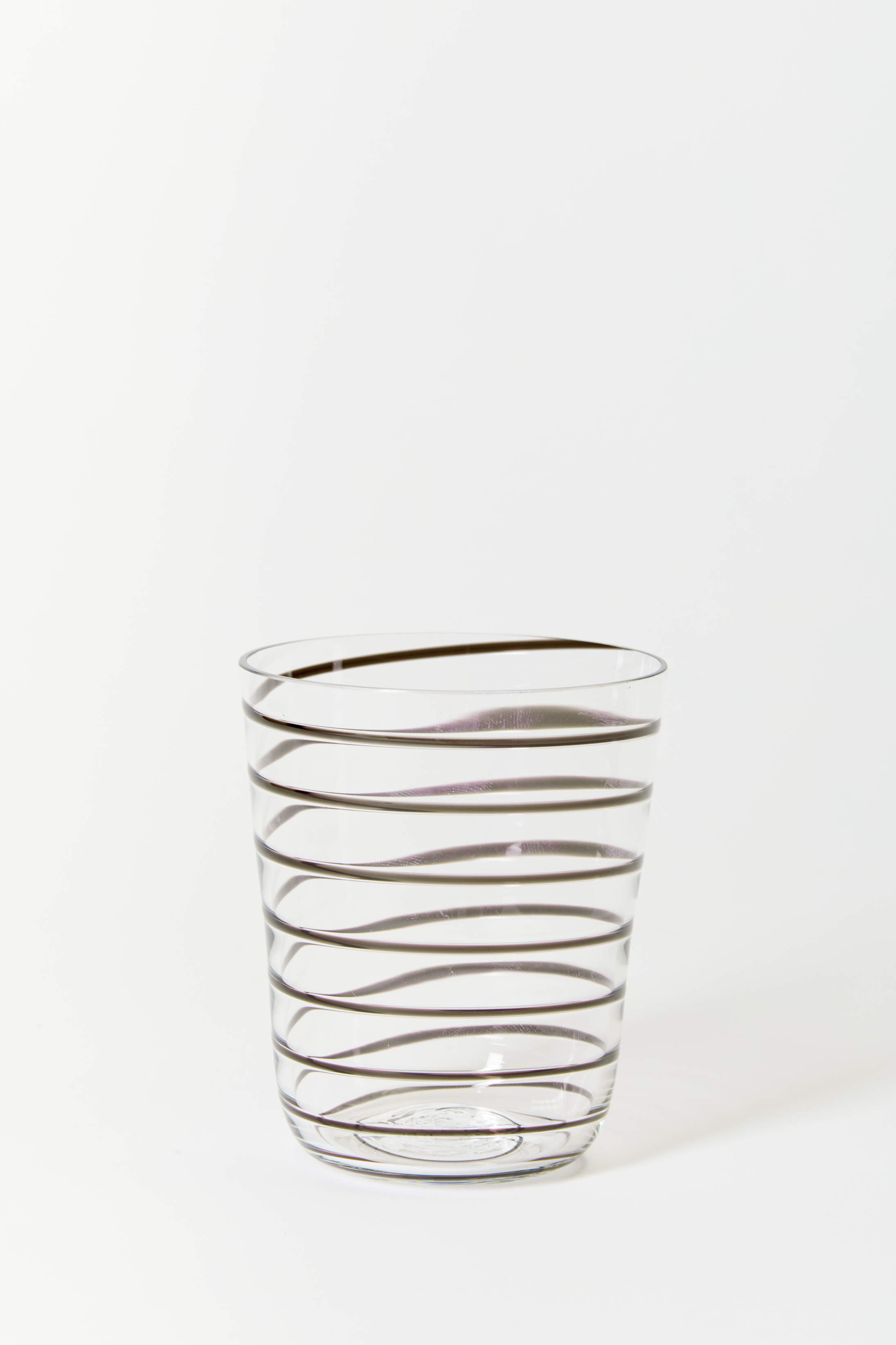 Transparent glass is embossed with a black stripe.