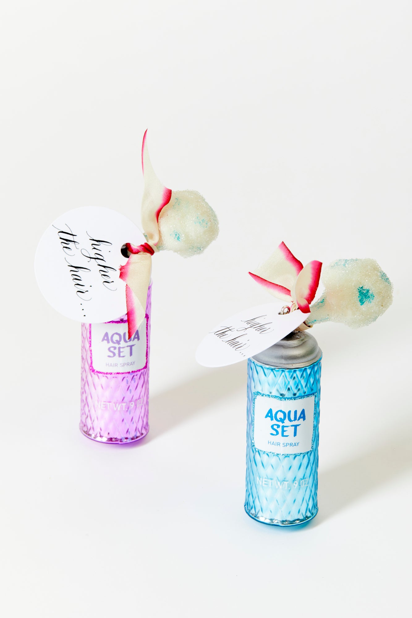 Hand-blown and hand-painted Hairspray ornament crafted in Poland.