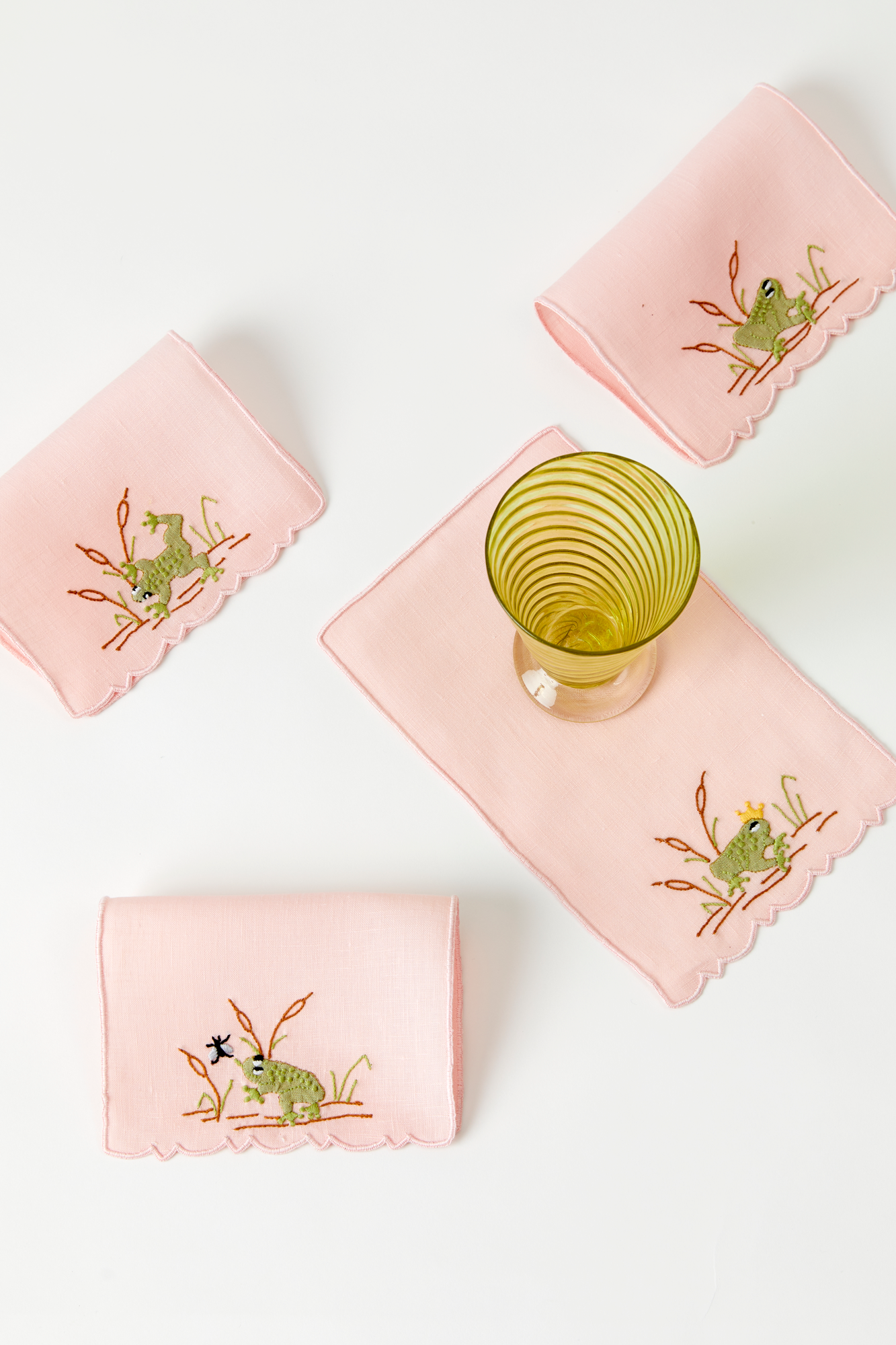 Frog in a pond cocktail napkins feature French stitch appliqué made in Madeira, Portugal.