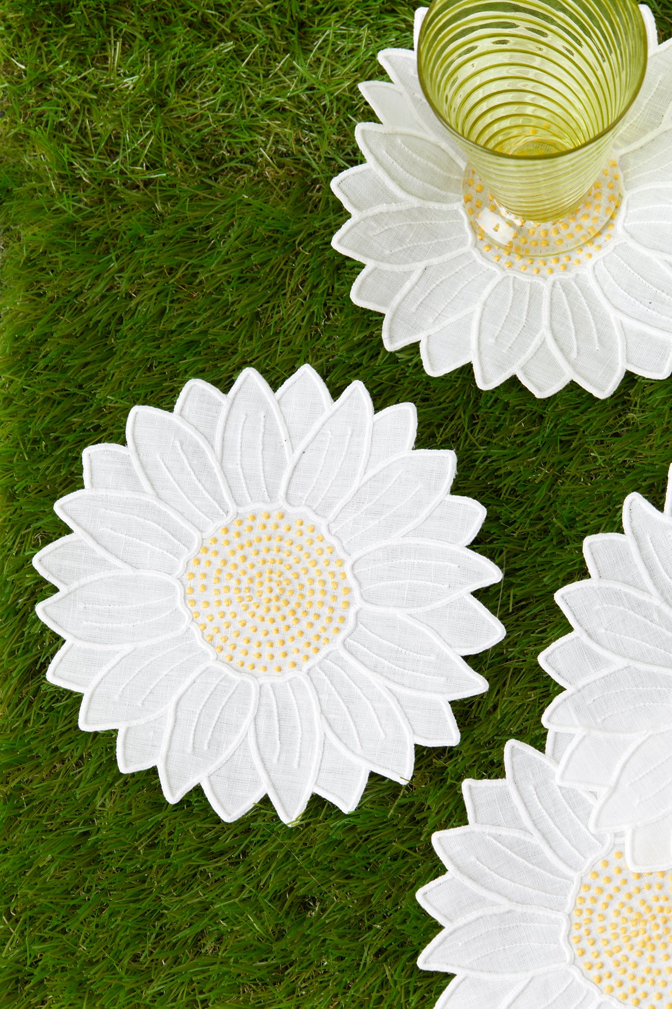 Set of four embroidered daisy linen cocktail napkins made in Madeira, Portugal.