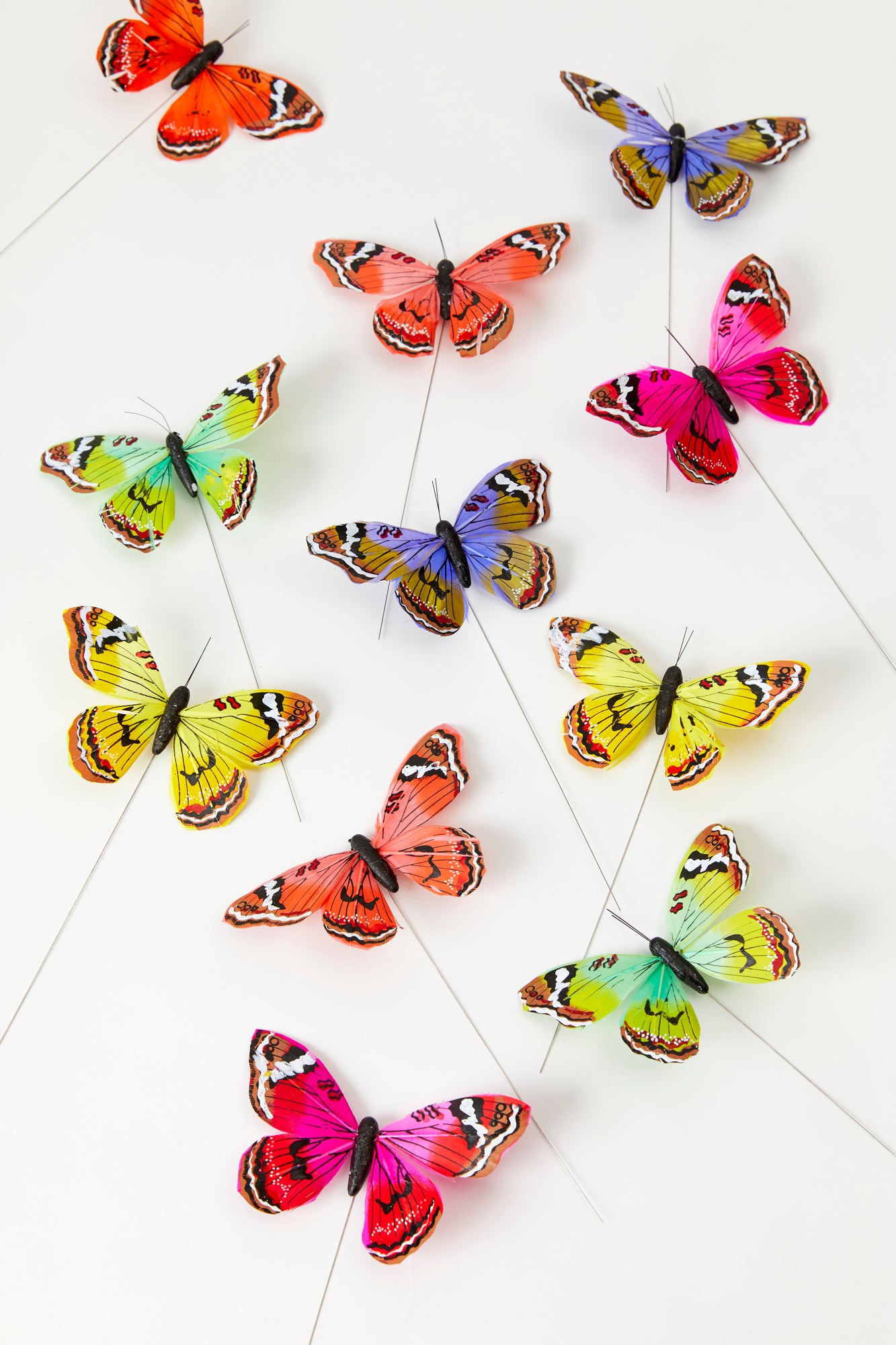 Delicate and colorful butterflies on tiny wires. Perfect for flower arrangements.