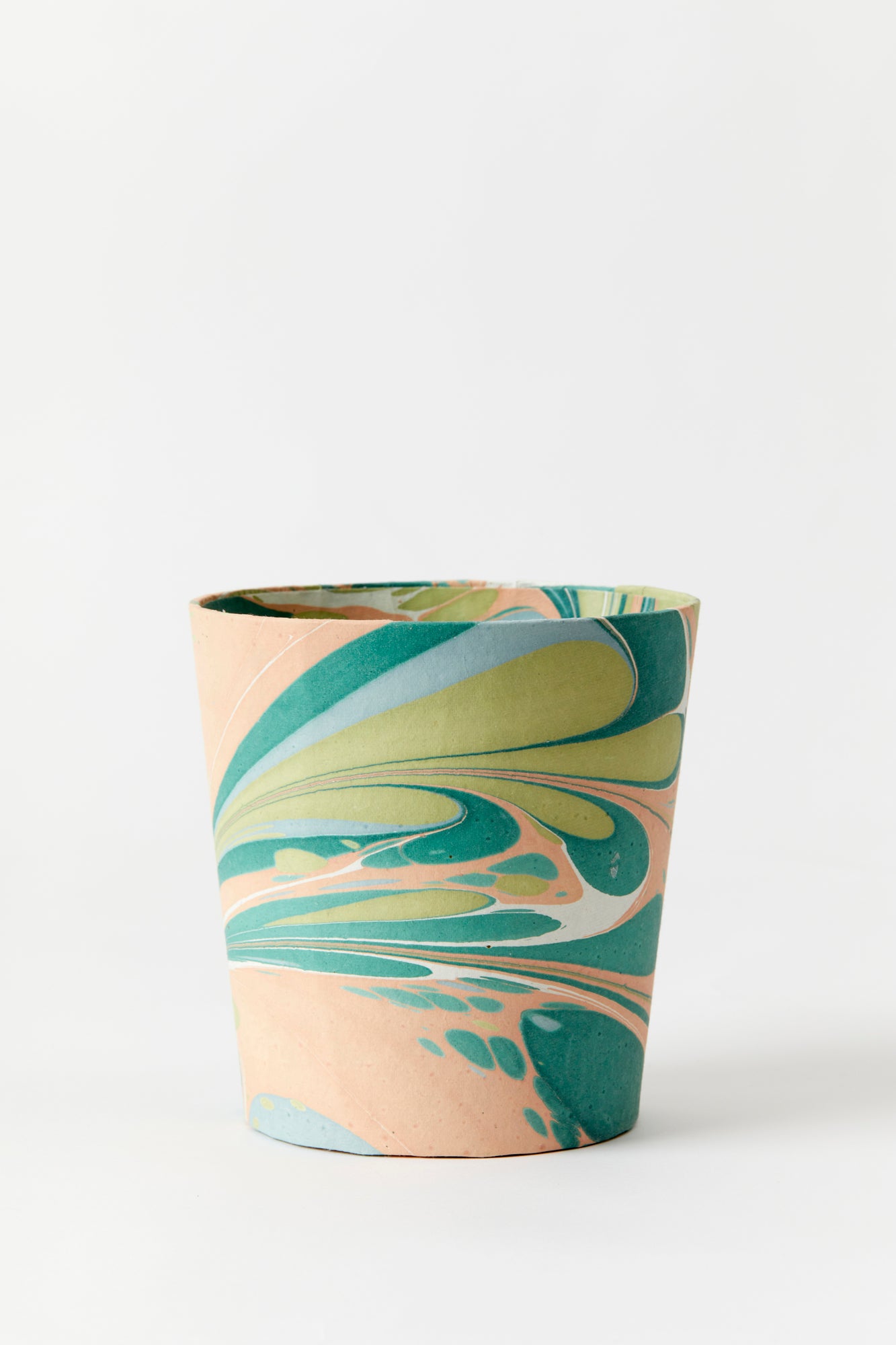 Artisan paper-covered cachepots with a plastic liner. Made to fit pots of standard seasonal bulbs or orchids.