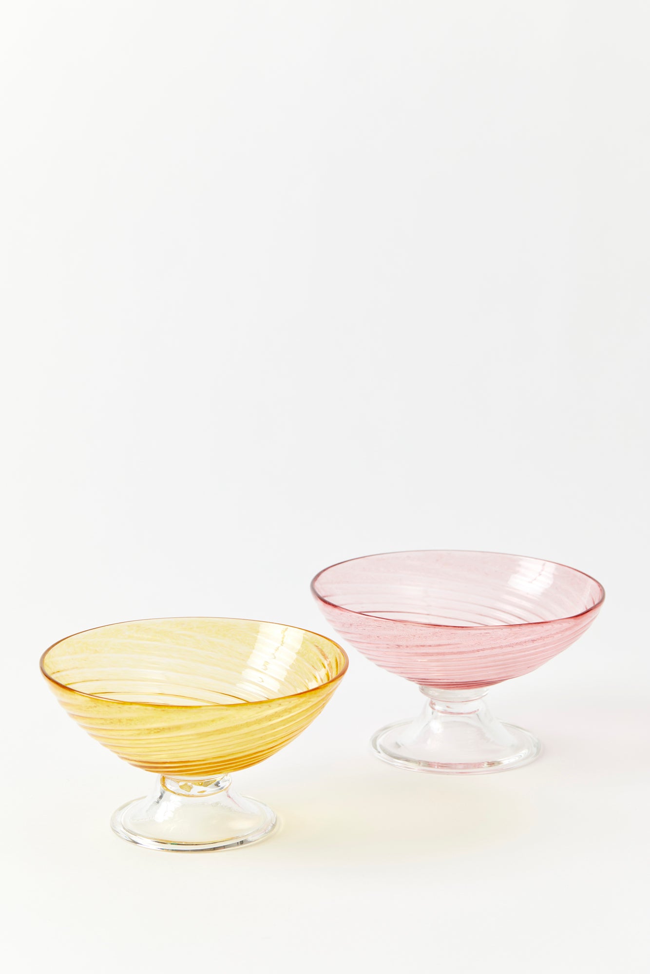 Handblown blush and gold glass dessert compote.