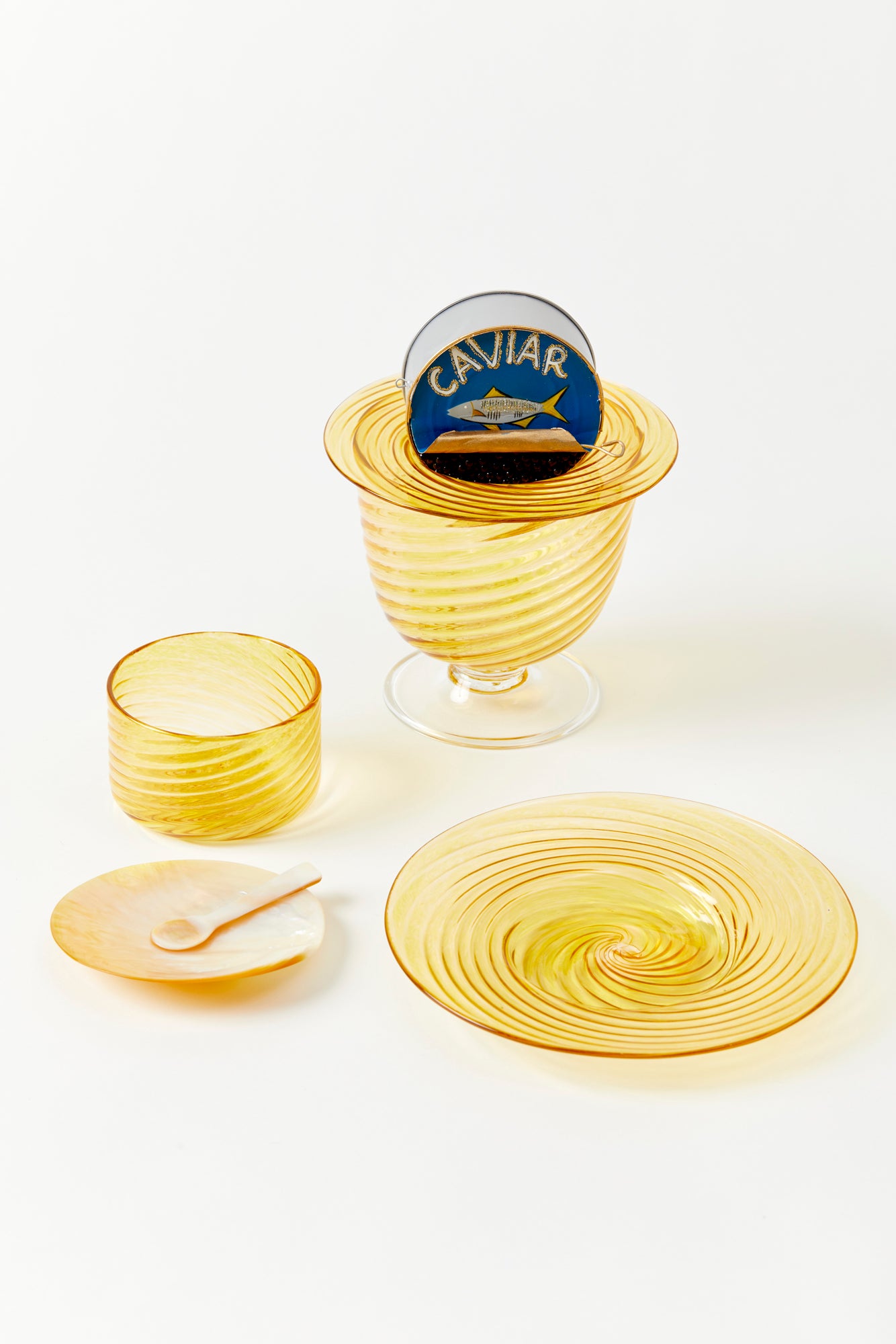 Artisanal twisted glass caviar service in gold, handblown by Tracy Glover in her Rhode Island studio.