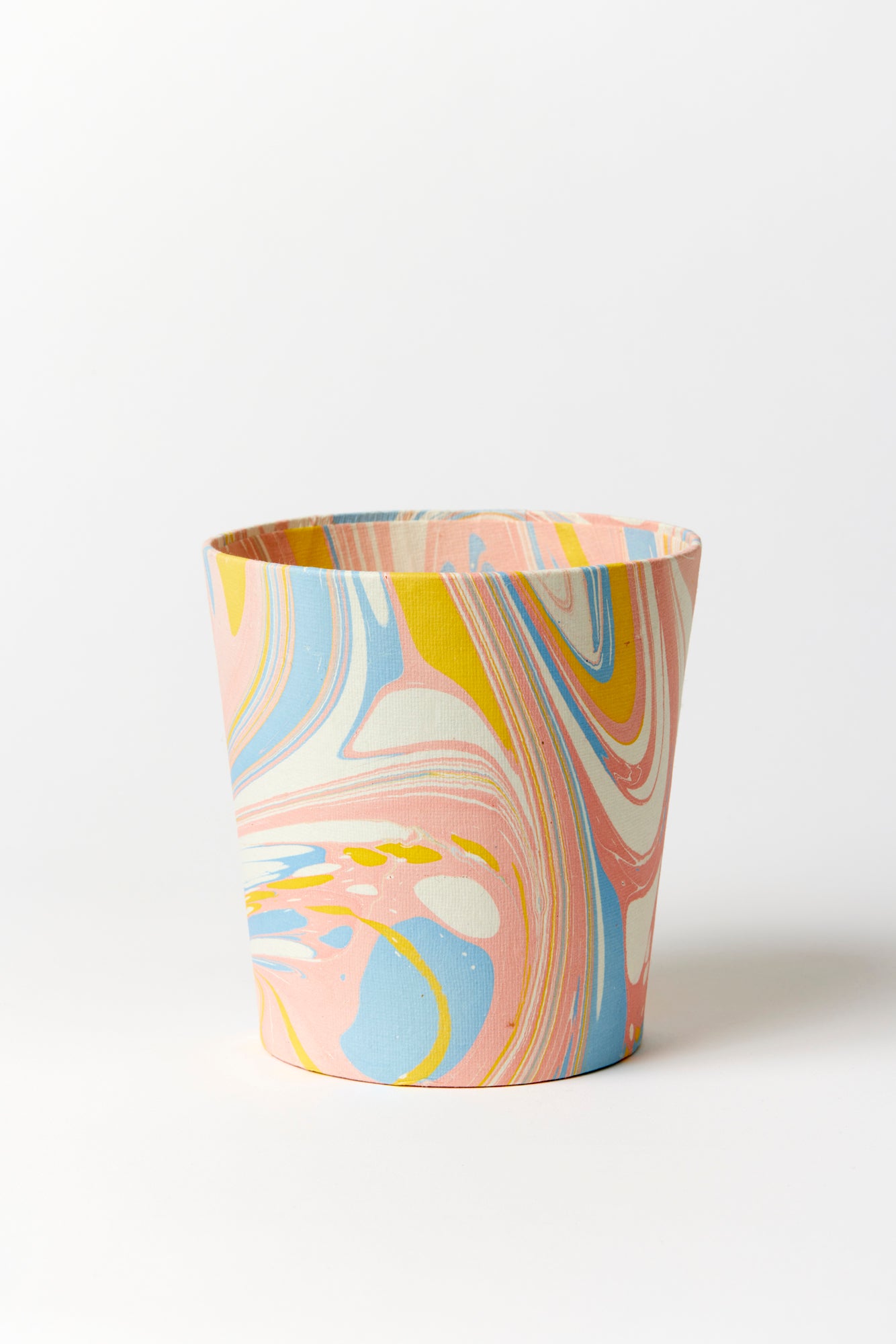 Artisan paper-covered cachepots with a plastic liner. Made to fit pots of standard seasonal bulbs or orchids.