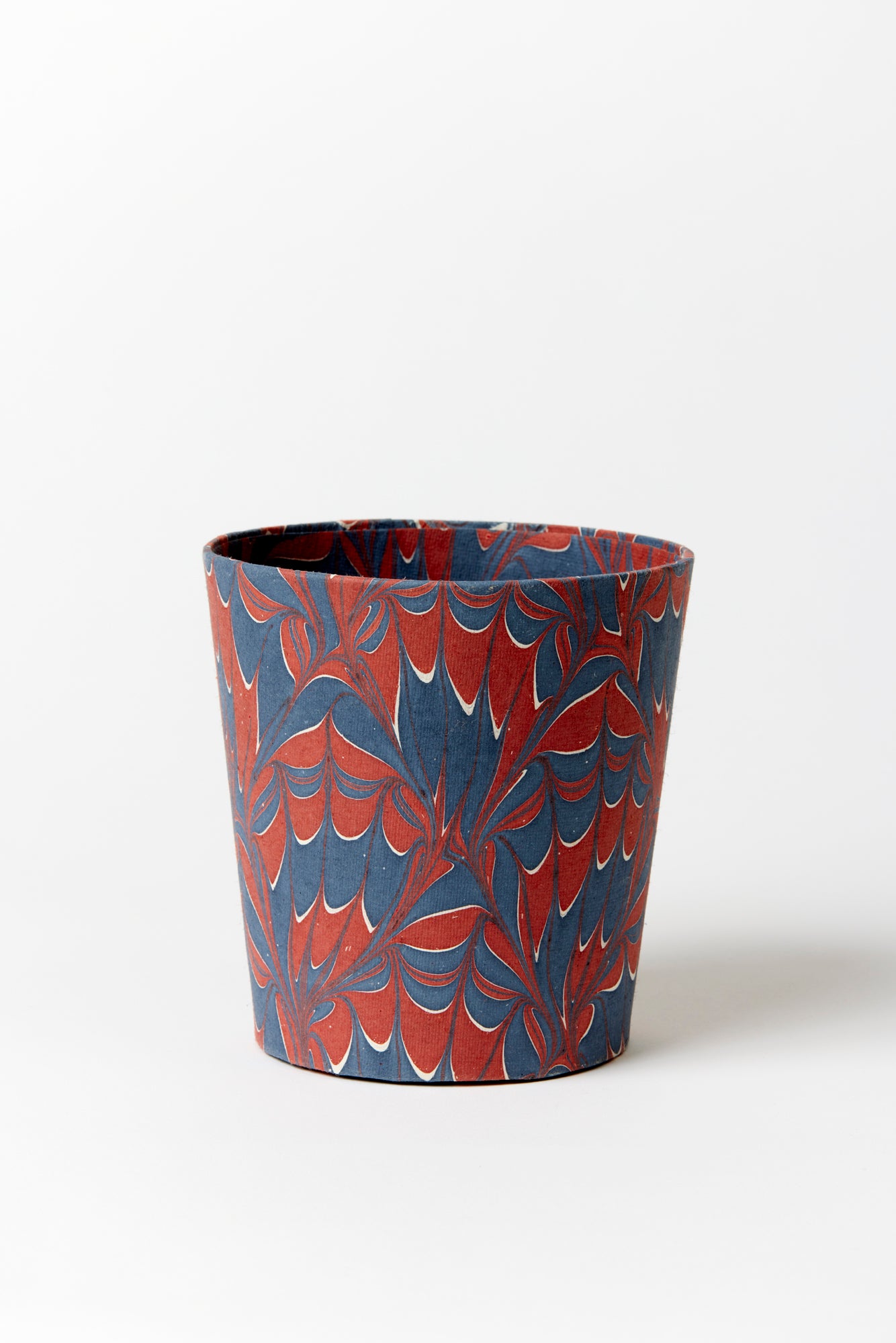 Artisan paper-covered cachepots with a plastic liner. Made to fit pots of standard seasonal bulbs or orchids.