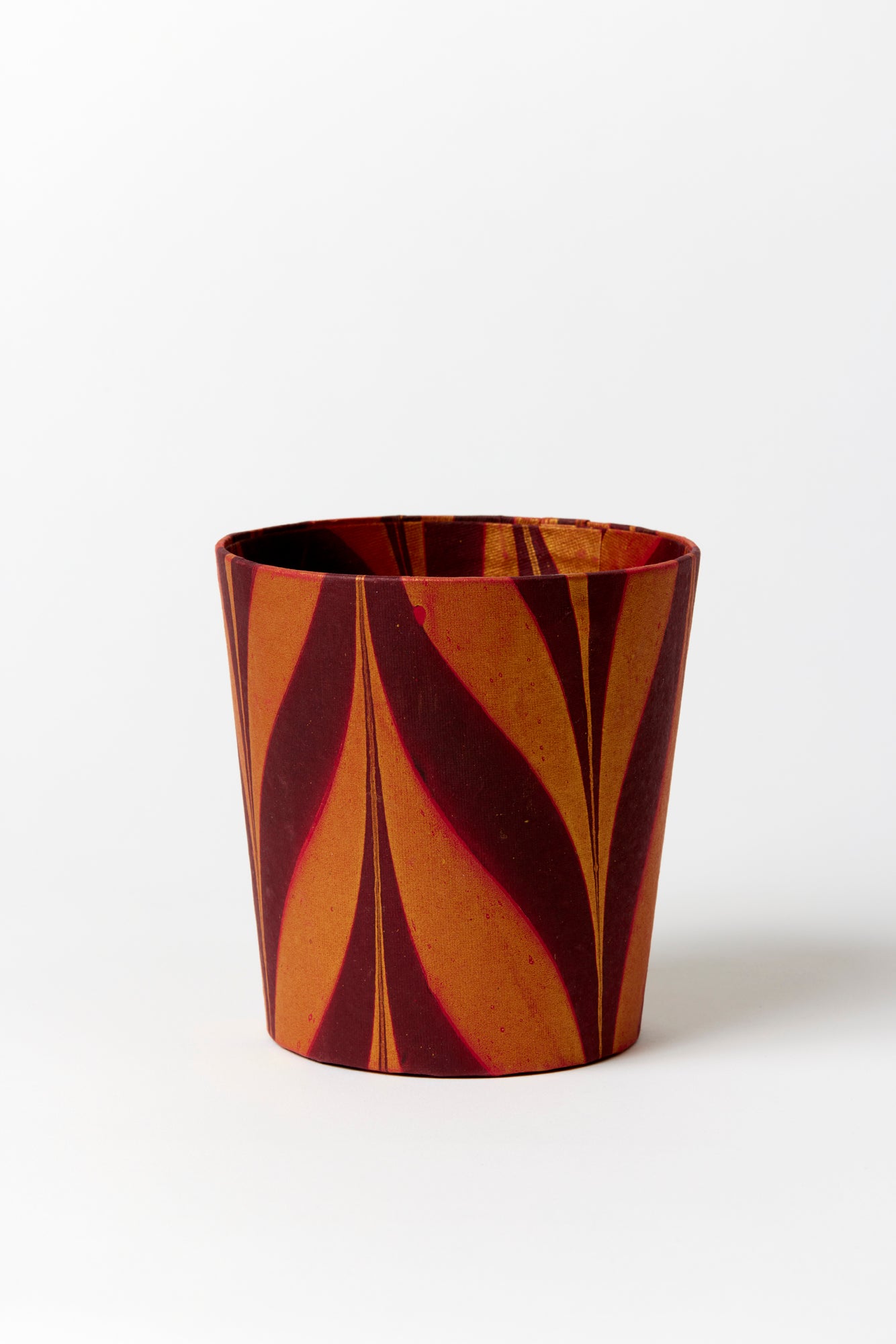 Artisan paper-covered cachepots with a plastic liner. Made to fit pots of standard seasonal bulbs or orchids.