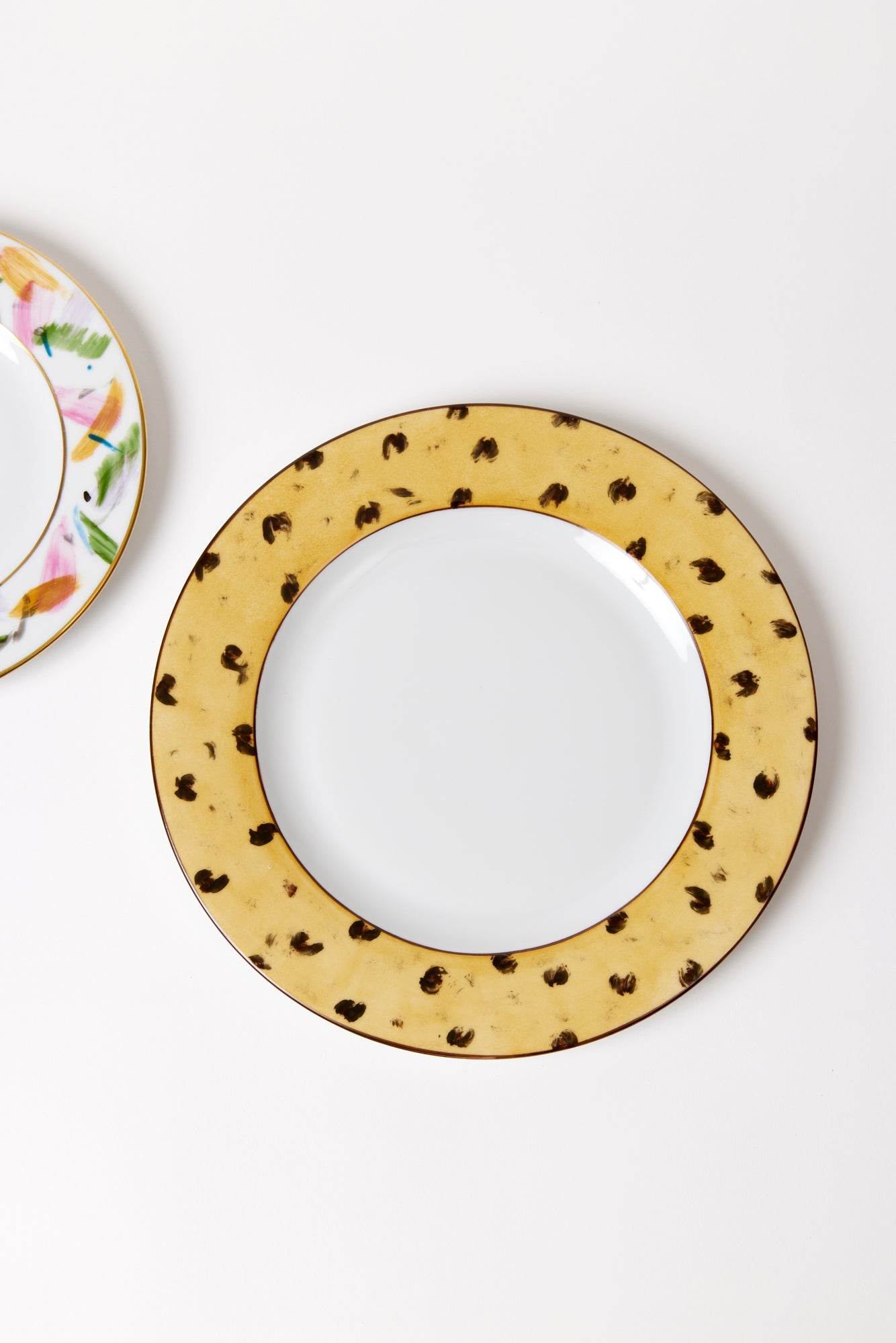 Hand-painted and traditionally crafted in an artisanal workshop in Arezzo, the spirited brushstrokes on this porcelain salad plate give a youthful twist to classic china.