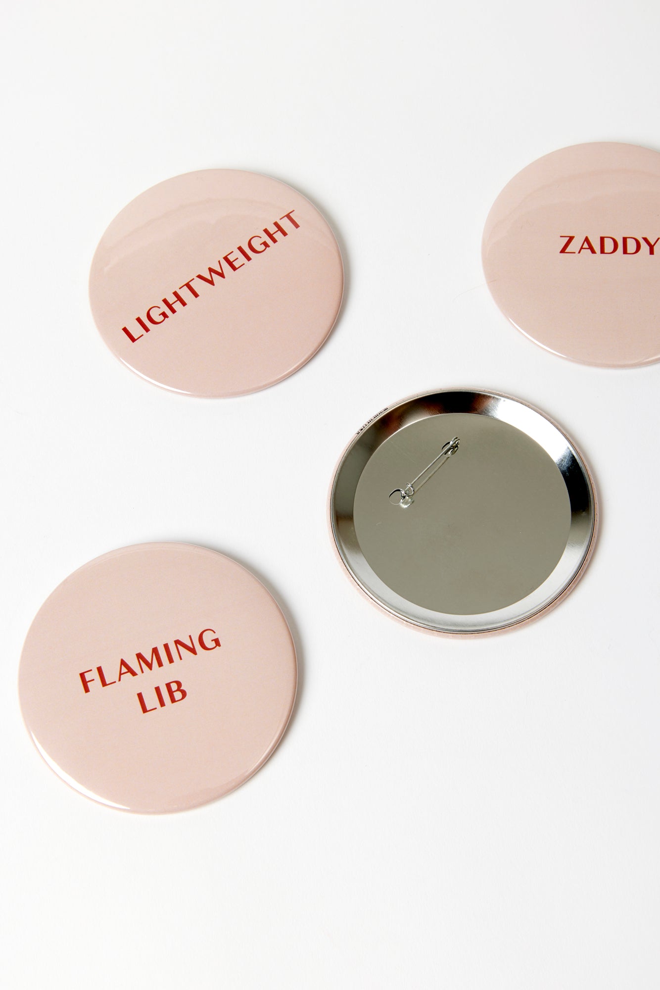 Buttons with different taglines for party favors.