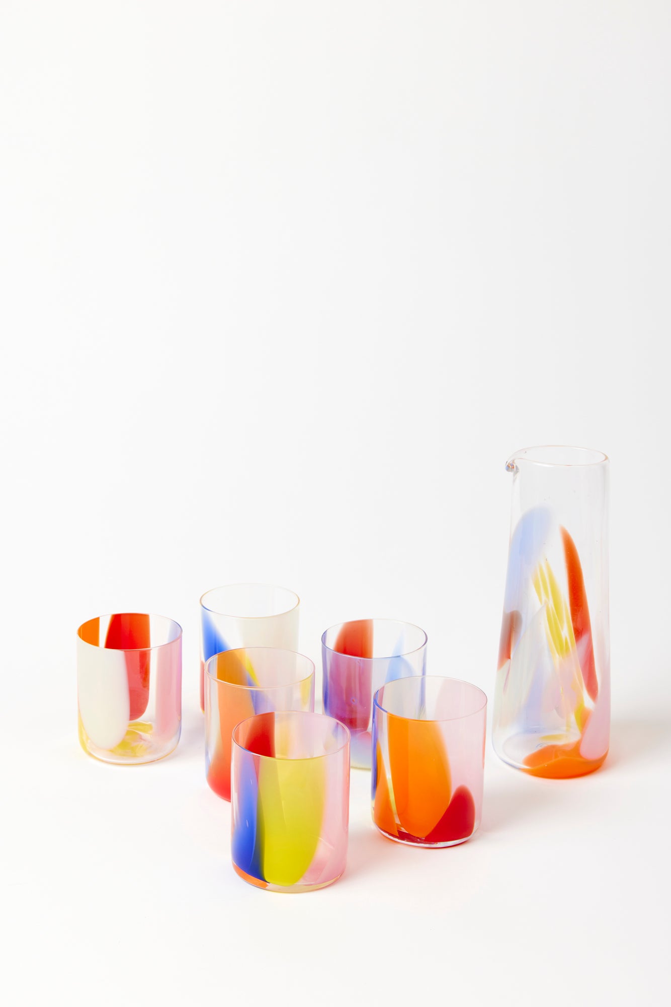 Colorful glass pitcher and matching tumblers.