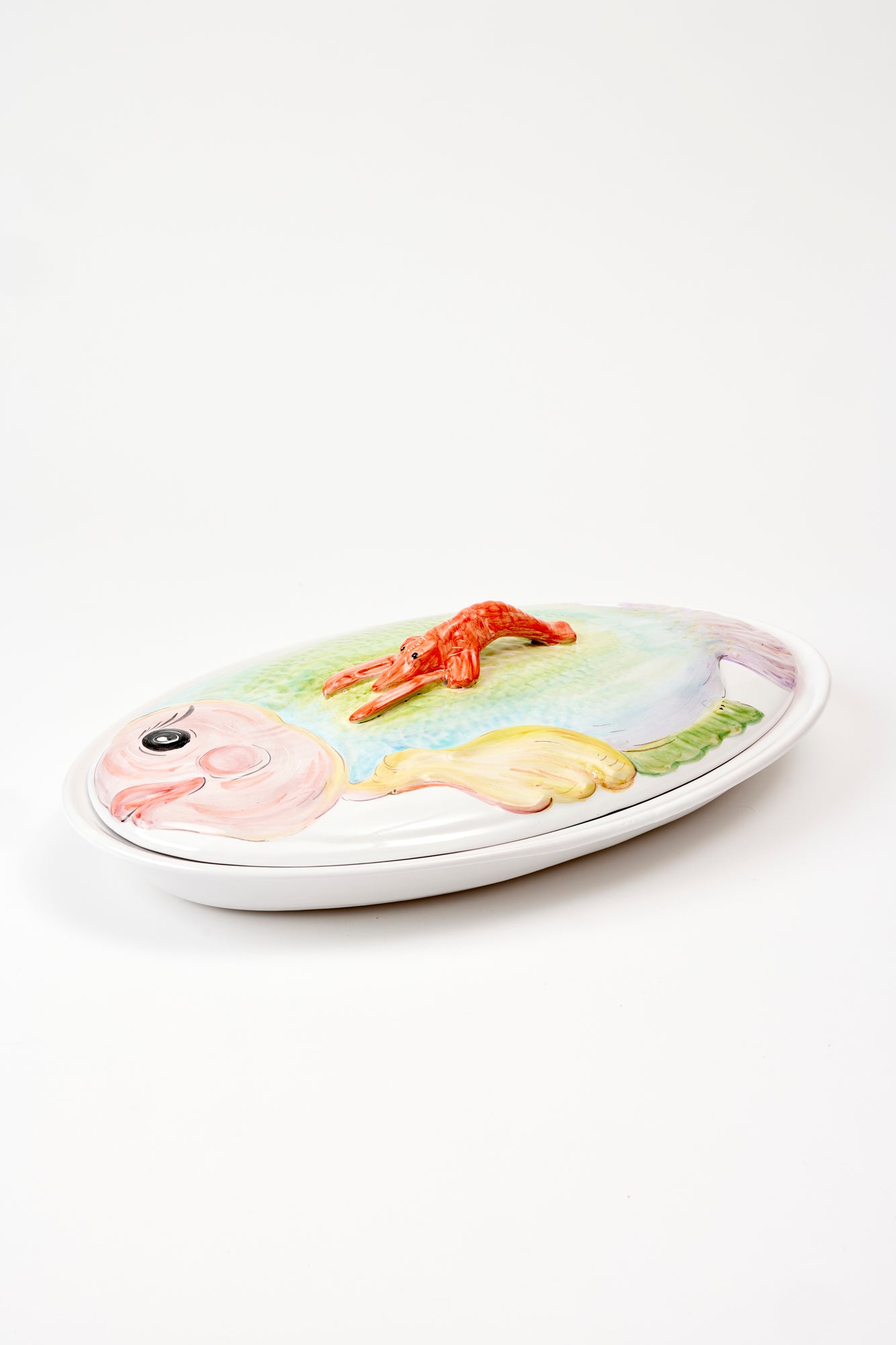 Covered fish serving dish.