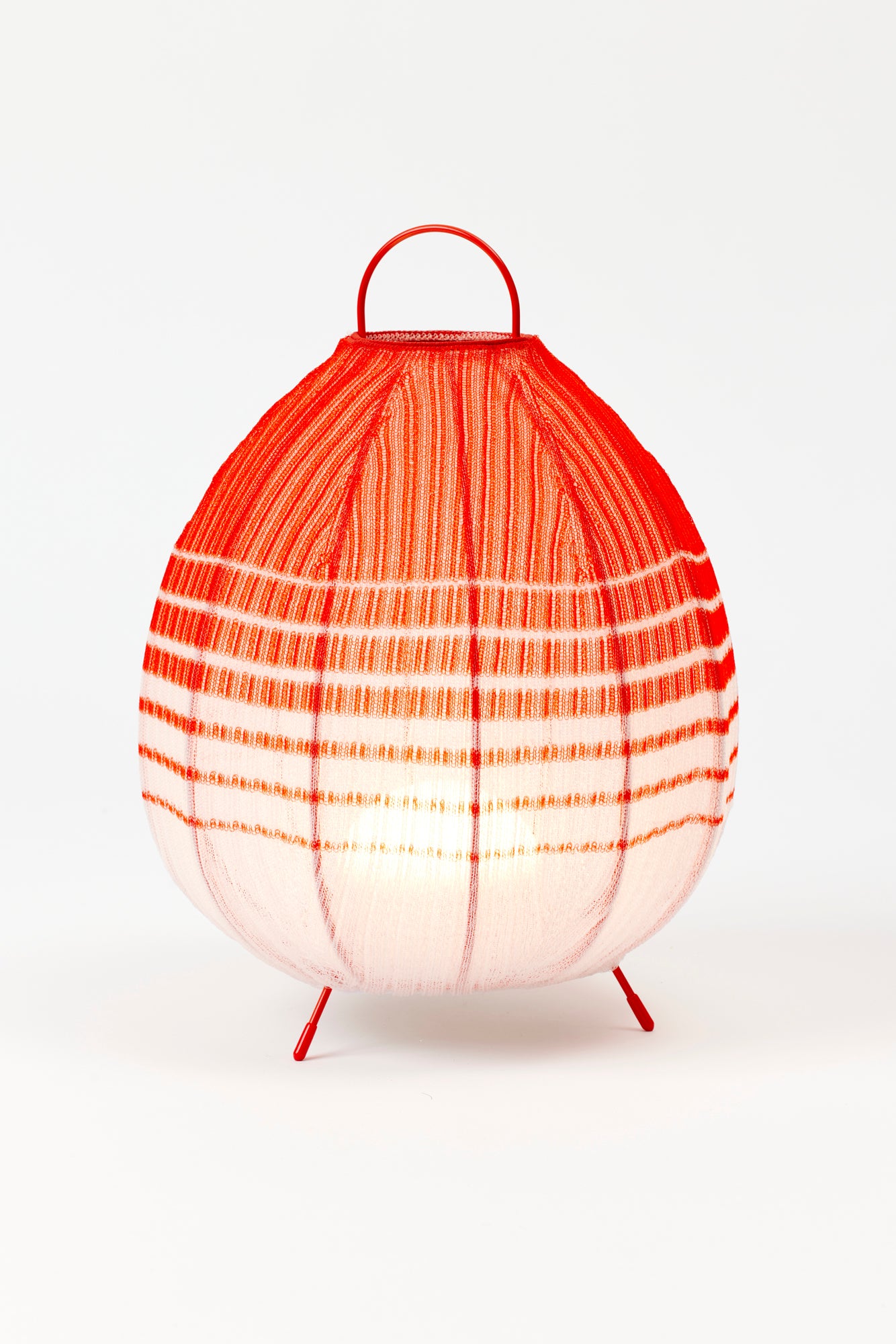 Portable table lanterns made from nylon knitted onto a lacquered steel base to emulate the textures of native Mexican flora. Designed and made in Madrid.