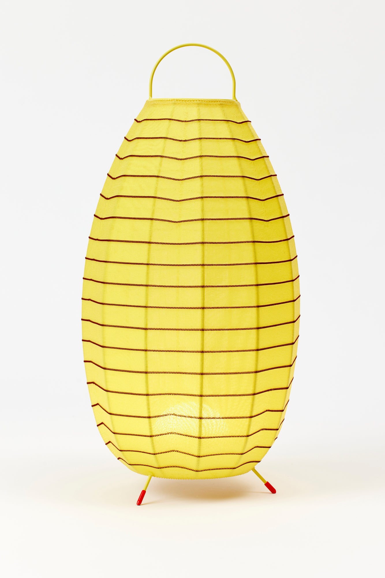 Portable table lanterns made from nylon knitted onto a lacquered steel base to emulate the textures of native Mexican flora. Designed and made in Madrid.