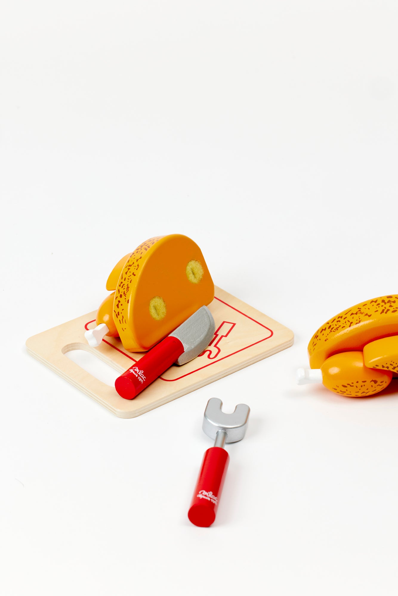 Wooden roast turkey with cutting board.