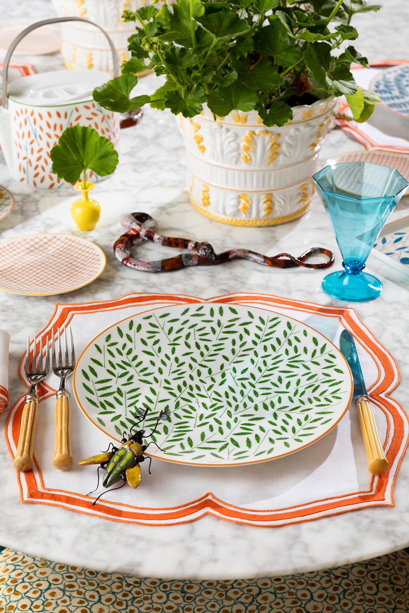 Dinnerware designed by Irish illustrator Nigel Peake, Hermes' "A Walk in the Garden" takes us on a picturesque path through an English garden.