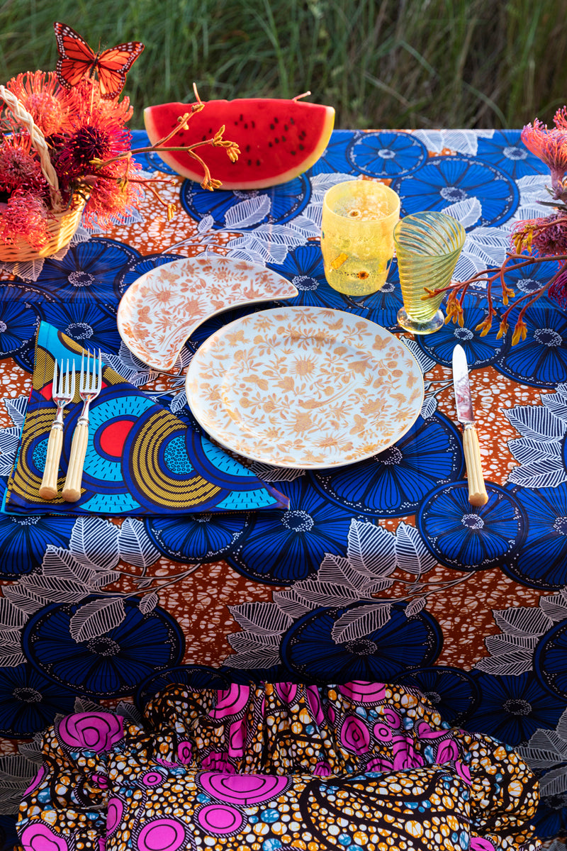 Sacred birds in orange print. Five piece place setting includes dinner plate, dessert plate, bread & butter plate and teacup with saucer.