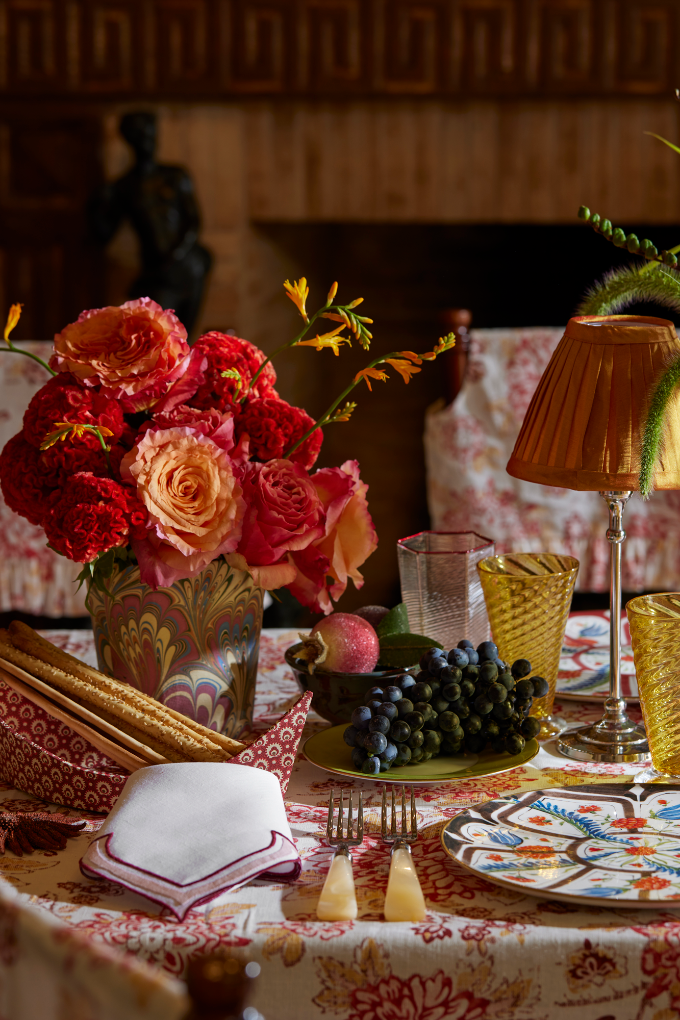 Crimson and crepe colored linen dinner napkin in an unusual scalloped design with embroidery and French stitch appliqué made in Madeira, Portugal.