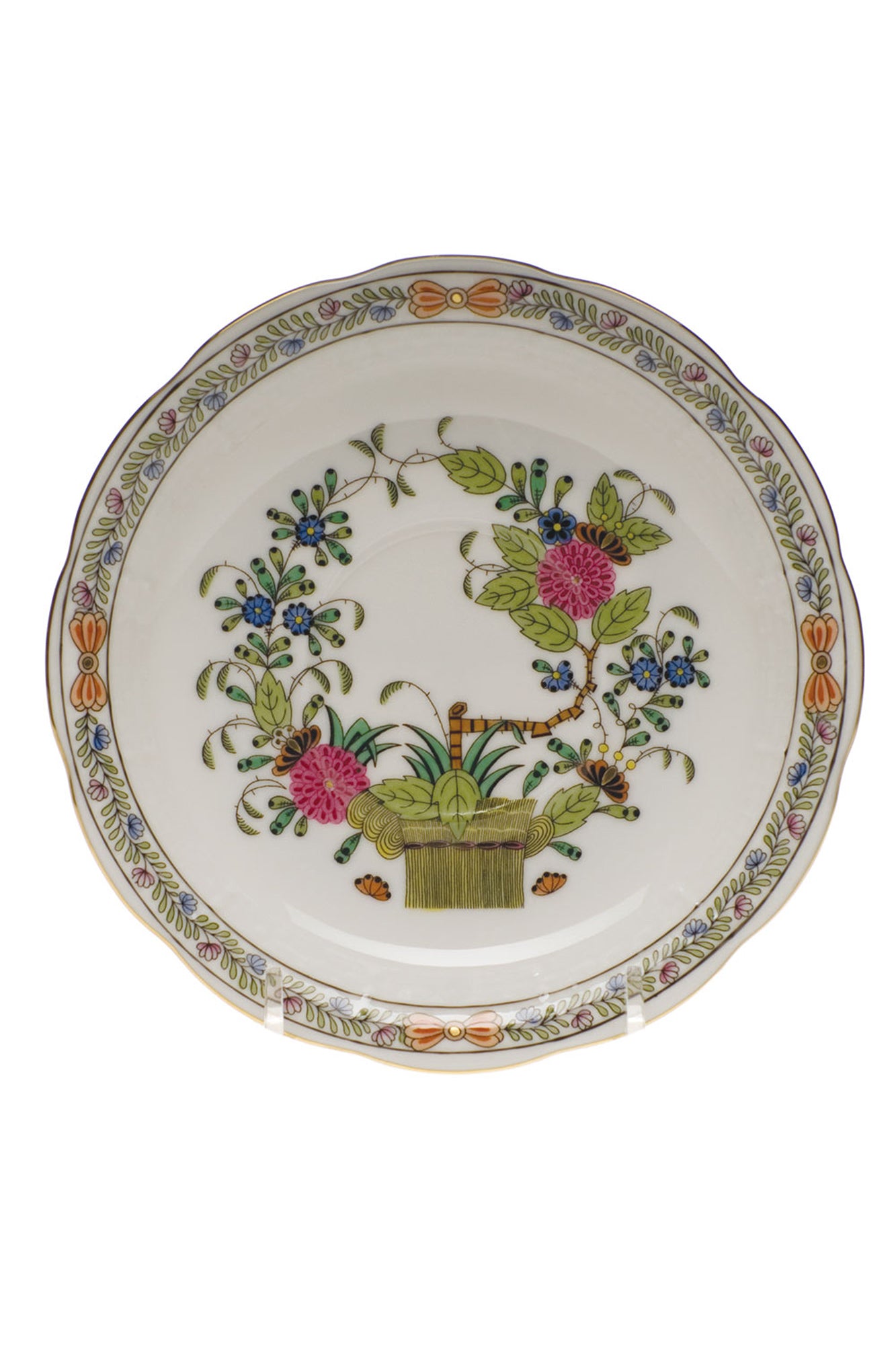 Porcelain dinnerware that has rich colors in an exotic pattern that stand alone with a solid cloth or add strong layers to a Bohemian look.