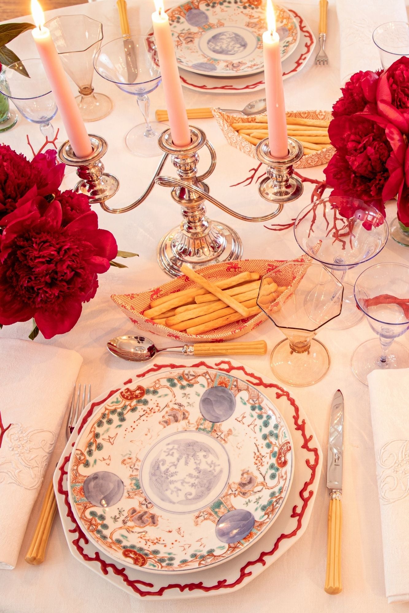 Uniquely beautiful patterned plates with a necklace of raised hand-painted red coral on the shoulder.