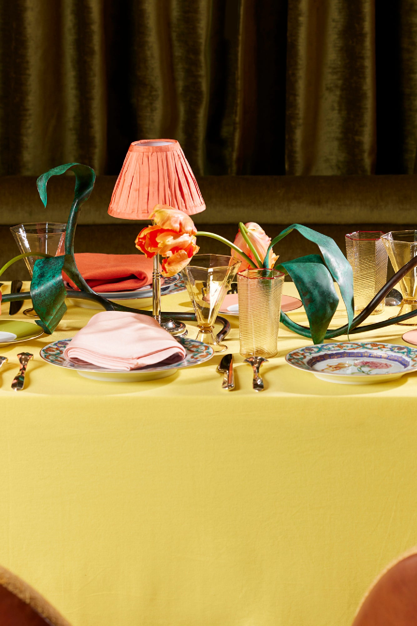 Table setting with Chartreuse tablecloth and coral table lamp base.