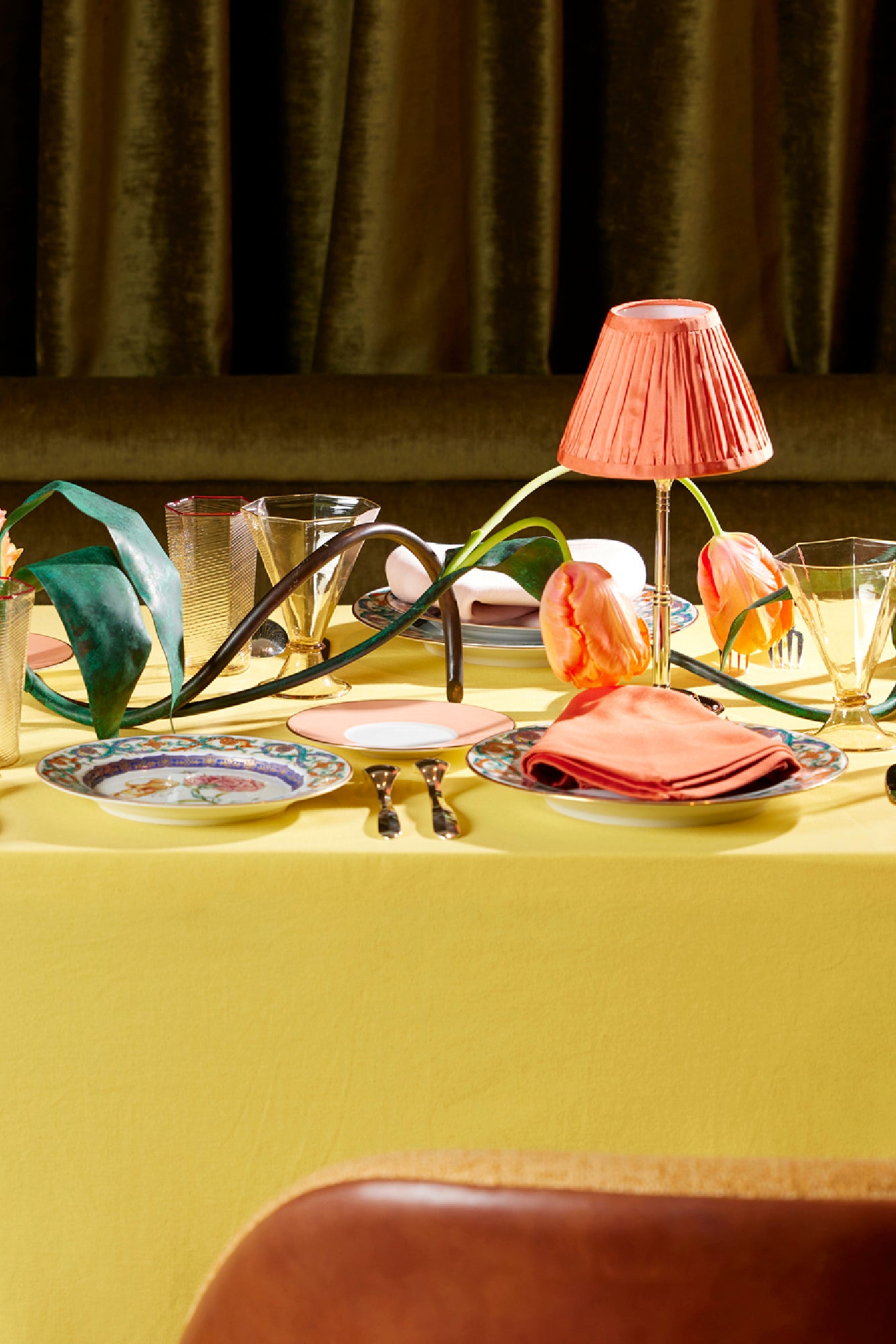 Table setting with Chartreuse tablecloth and coral table lamp shade.