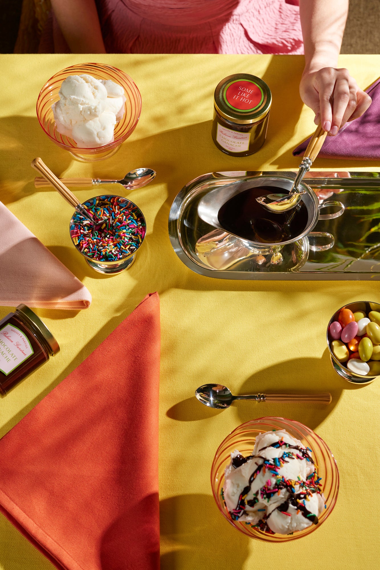 Table setting with Chartreuse tablecloth and chocolate sauce.
