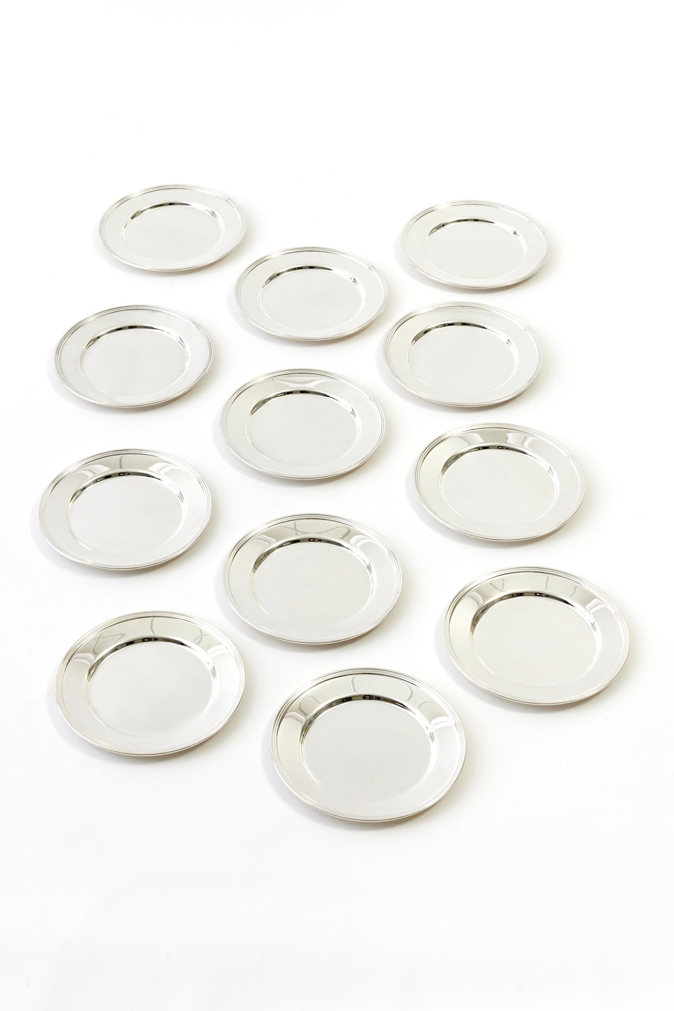 SET OF 12 VINTAGE ENGLISH SILVER COCKTAIL PLATES.