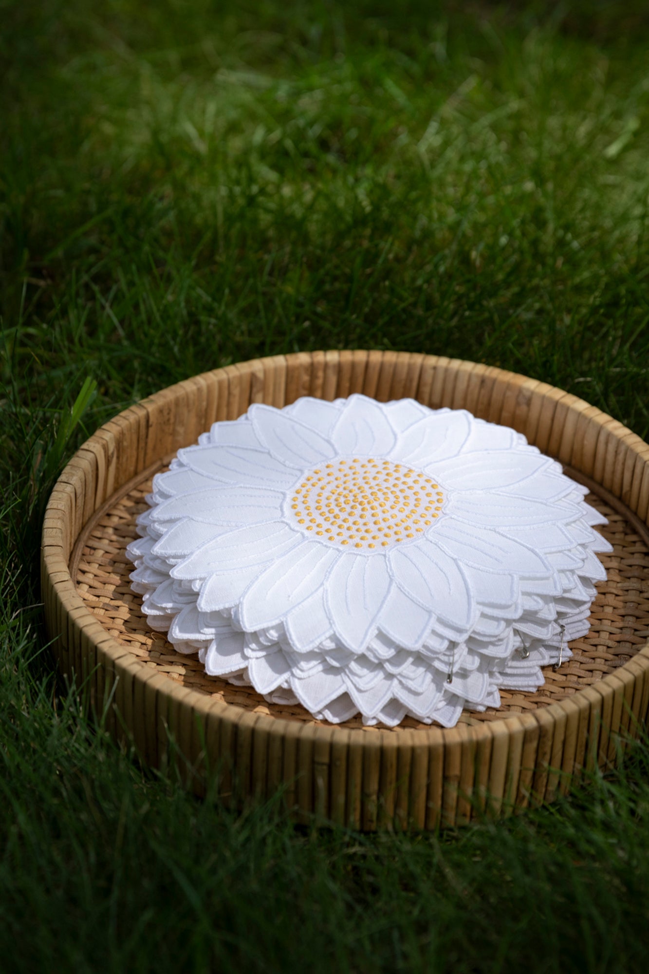 Set of four embroidered daisy linen cocktail napkins made in Madeira, Portugal.