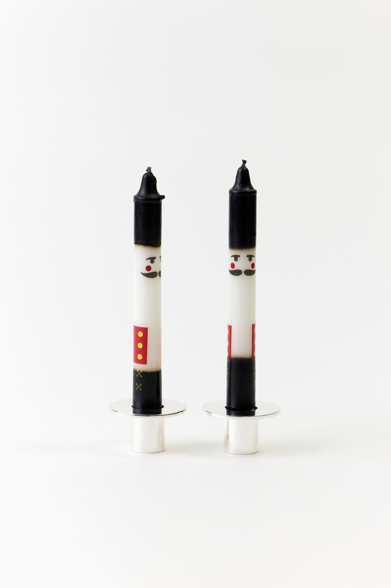 SET OF 2 NUTCRACKER TAPERS.