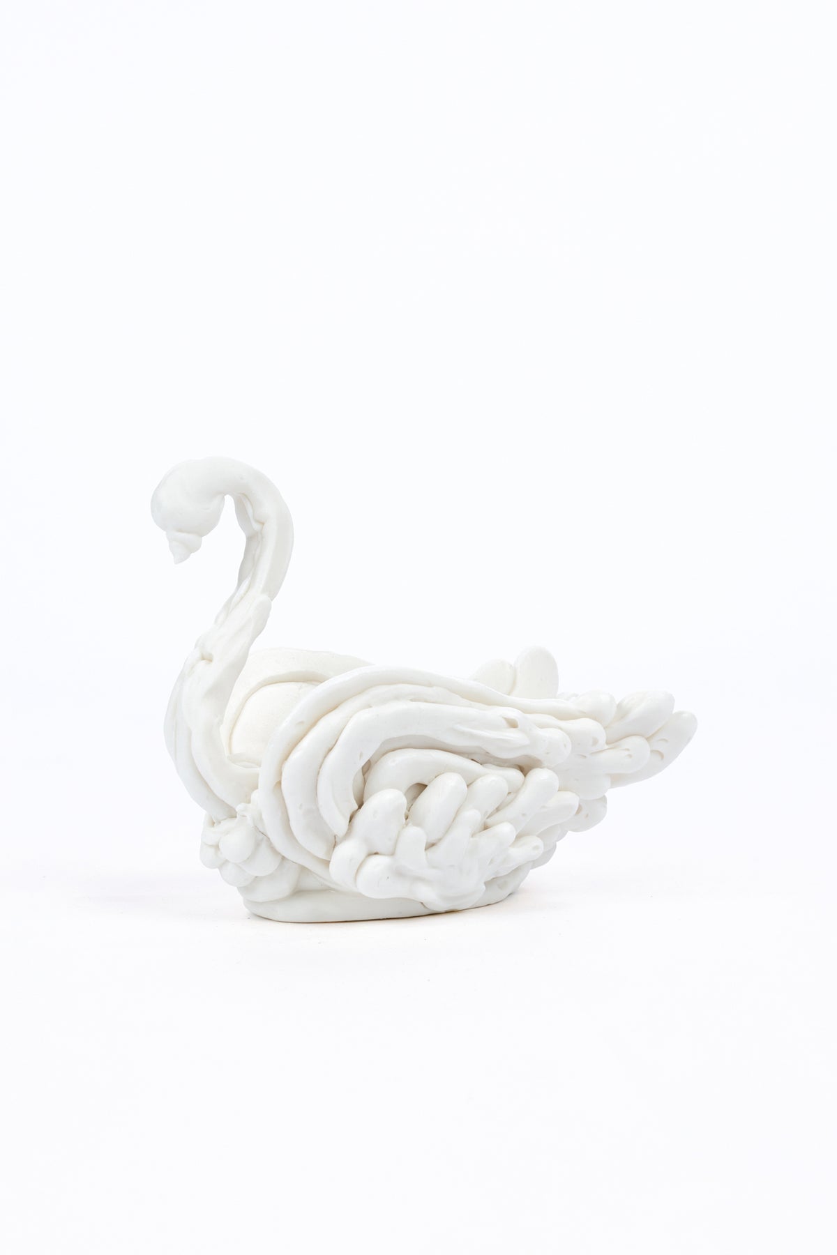 Faux porcelain swan made to look as if it was made of meringue.