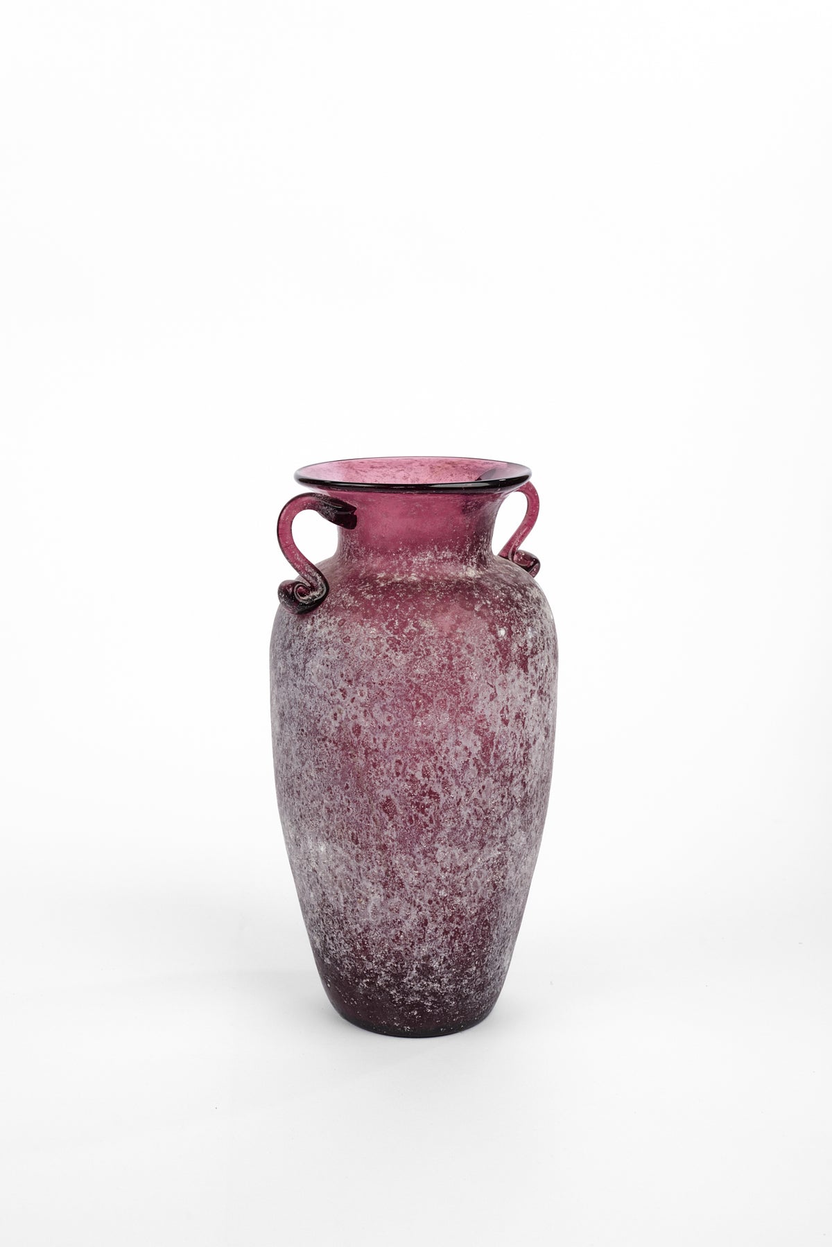 A vintage-style glass vase with a textured, frosted finish in a deep burgundy pink color, featuring two loop handles and a flared rim, set against a plain white background.