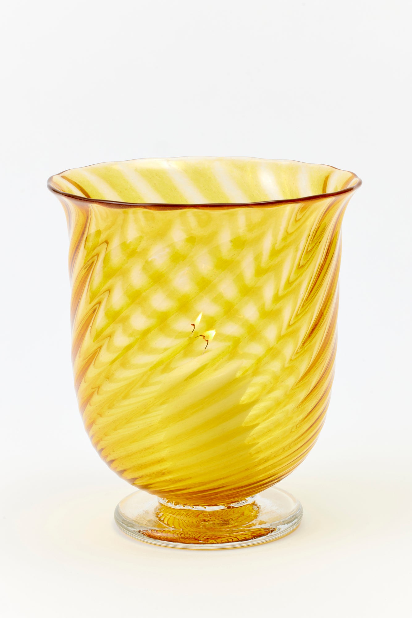 Hand blown twisted glass vase in a golden yellow color. 