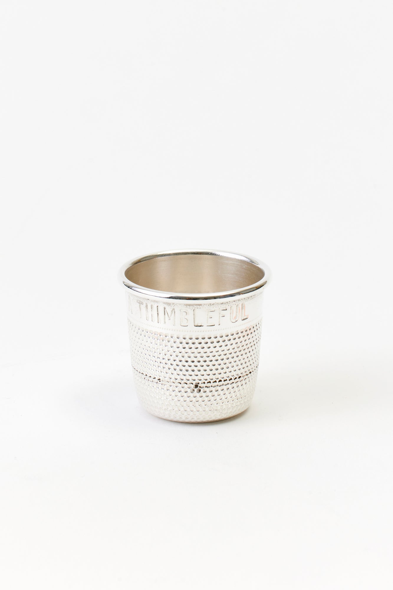 VINTAGE SILVER THIMBLE SHOT