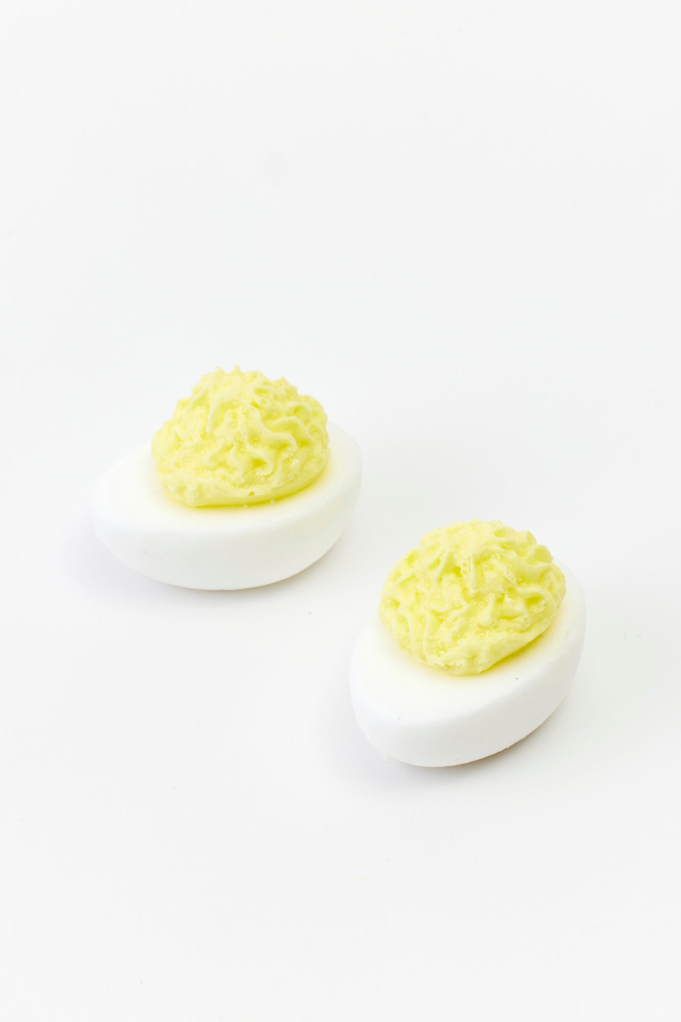 Set of 2 soaps that look like deviled eggs.