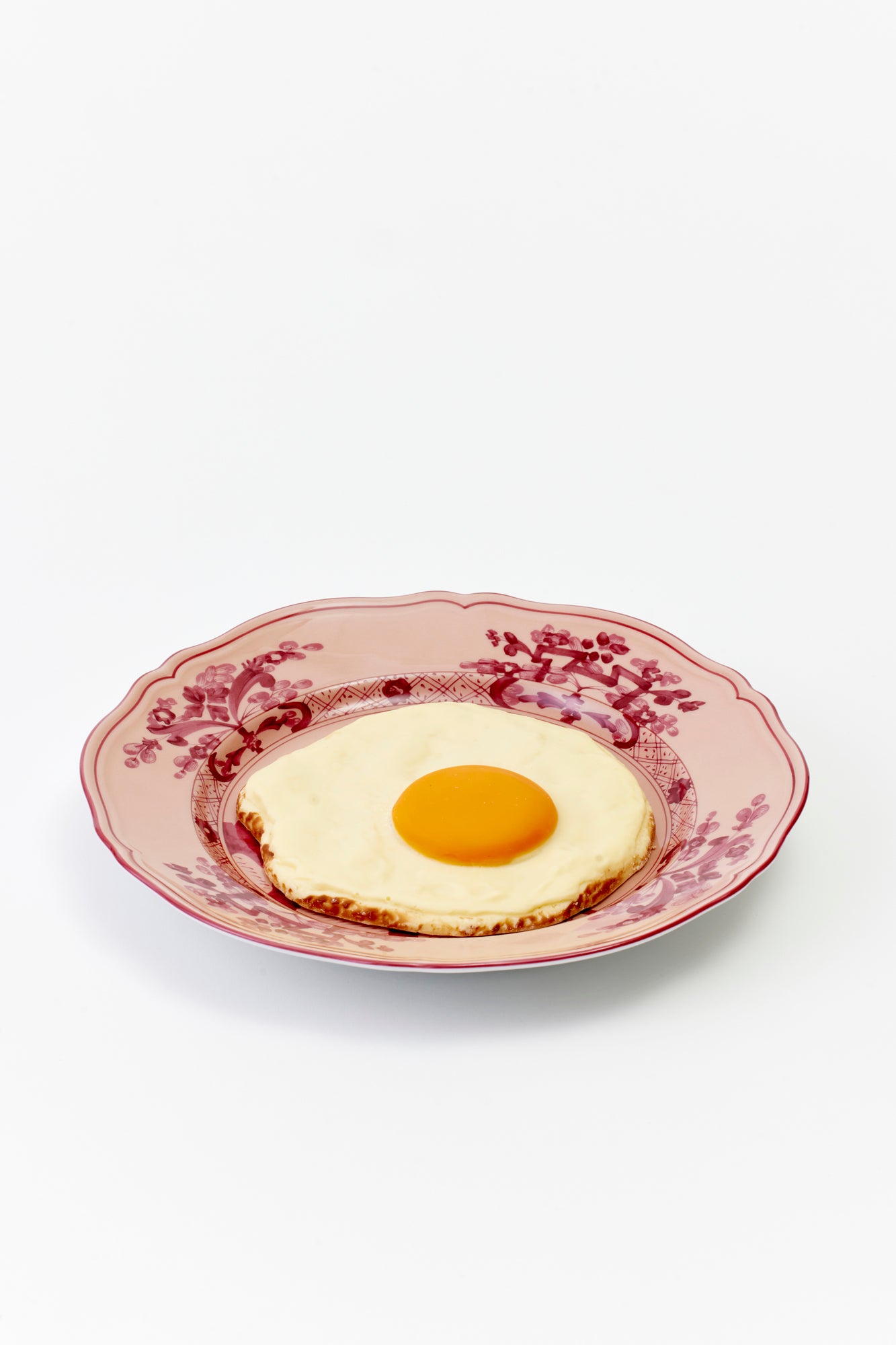 Giant fried egg made of chocolate.