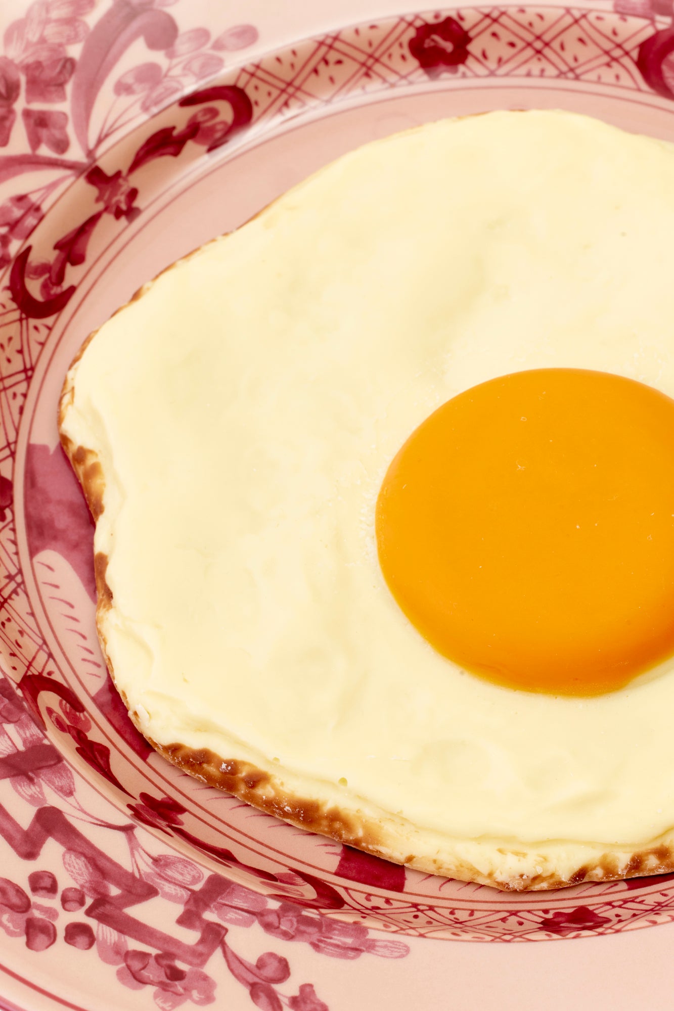 Giant fried egg made of chocolate.