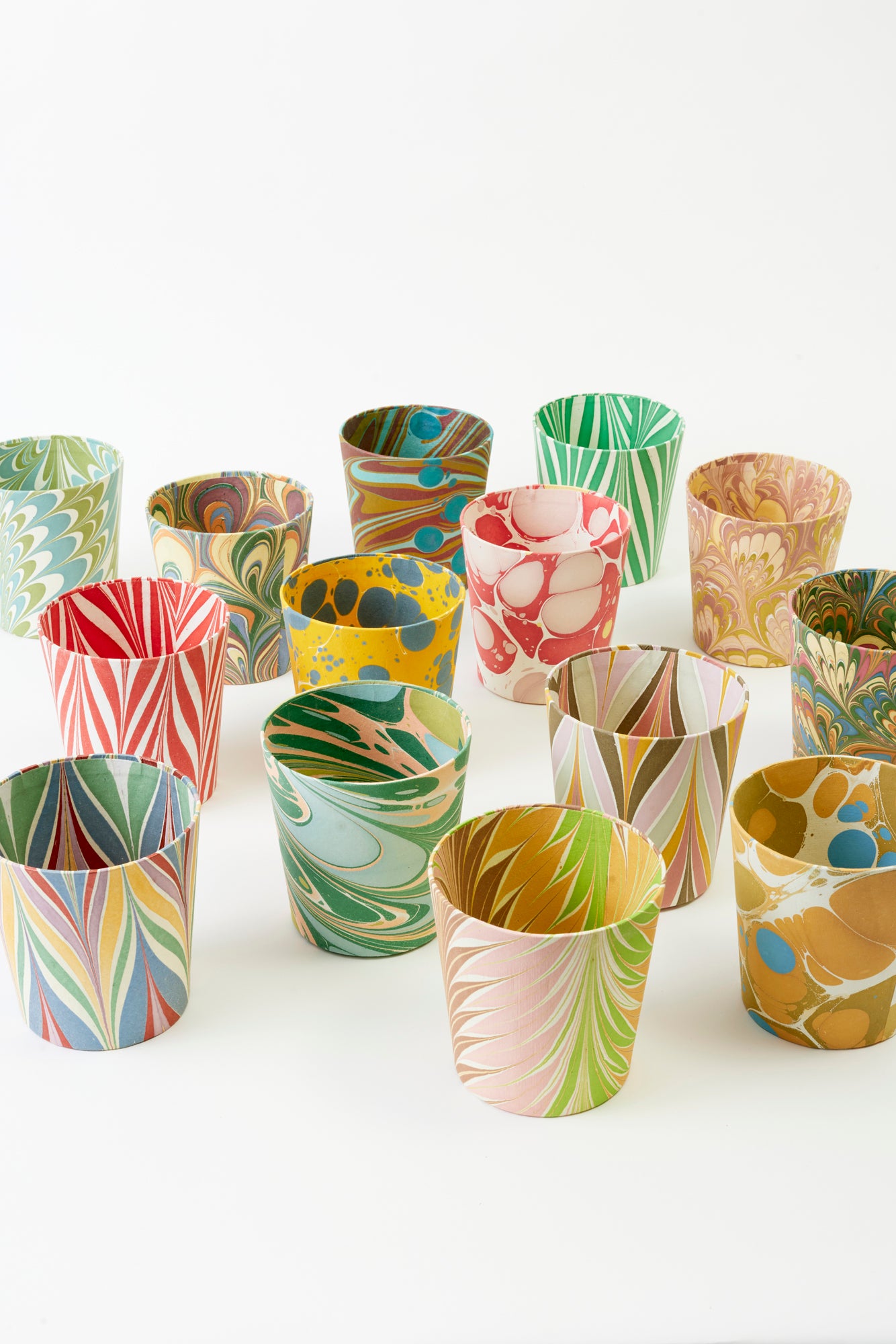 Artisan paper-covered cachepots with a plastic liner. Made to fit pots of standard seasonal bulbs or orchids.