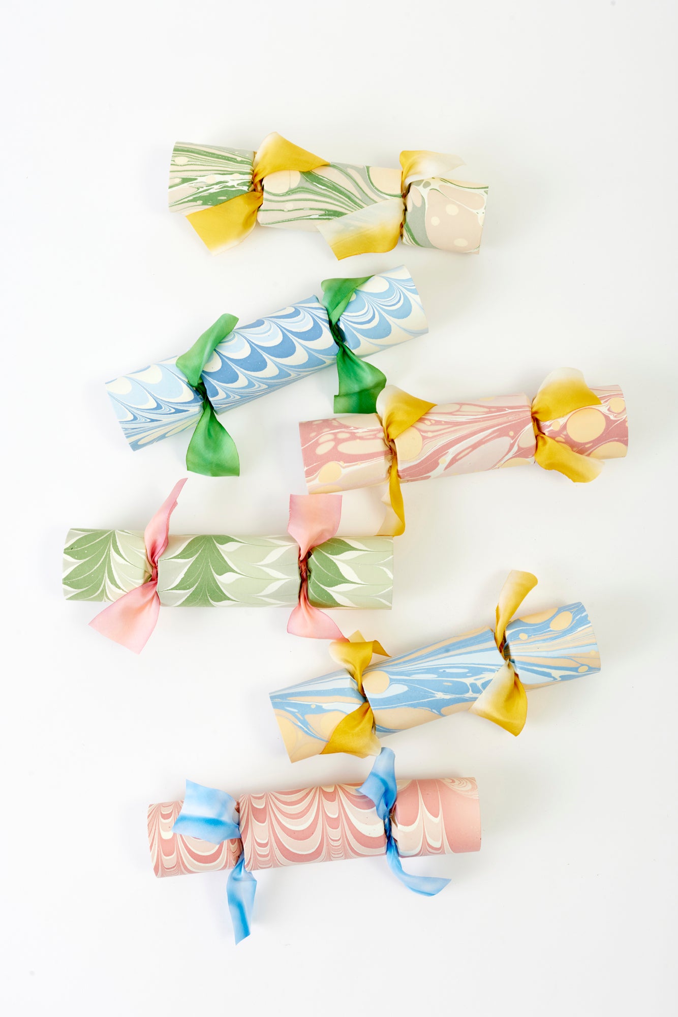 Pastel marbled party crackers filled with suprises.