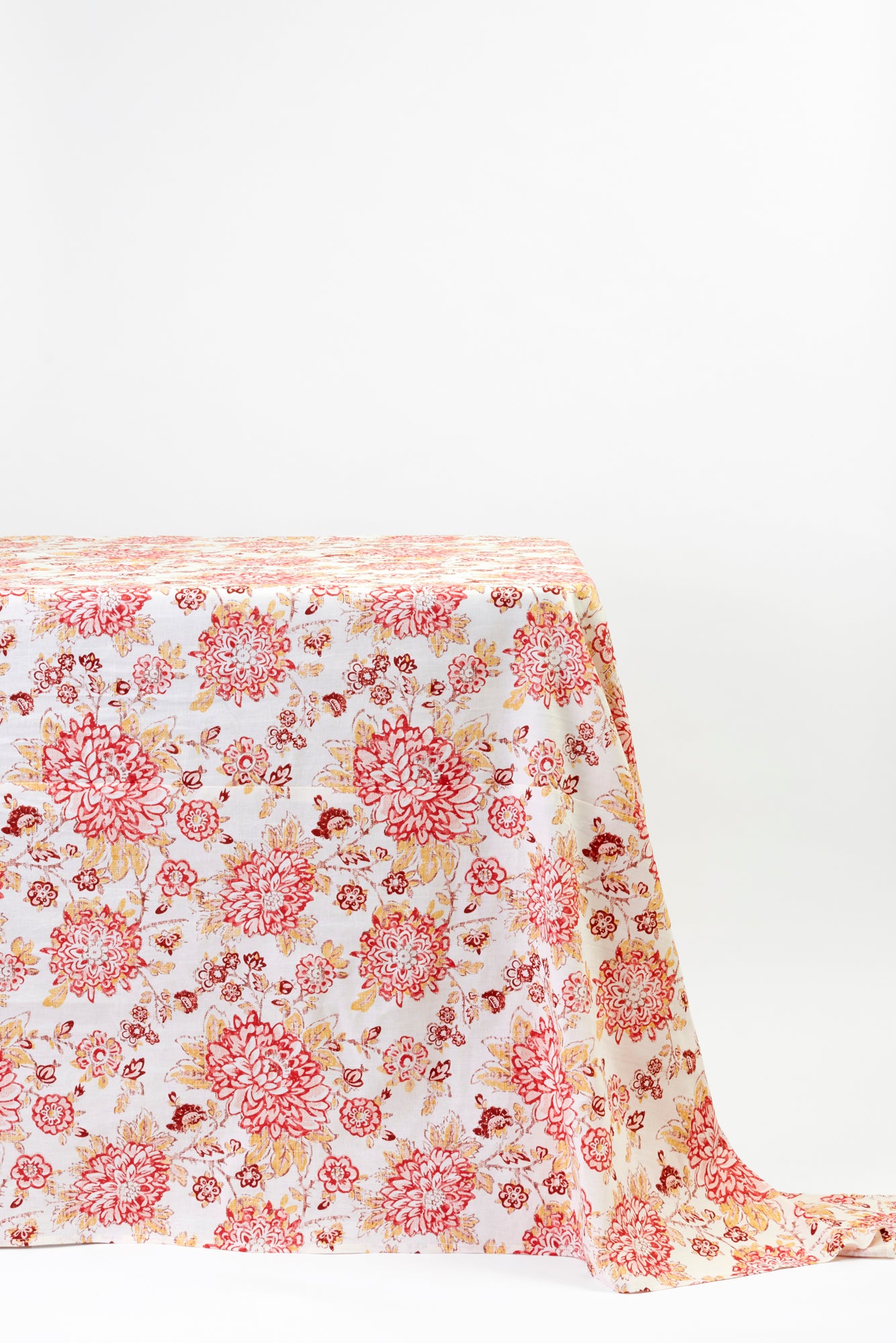 Spicy red and pink floral tablecloth to the floor.