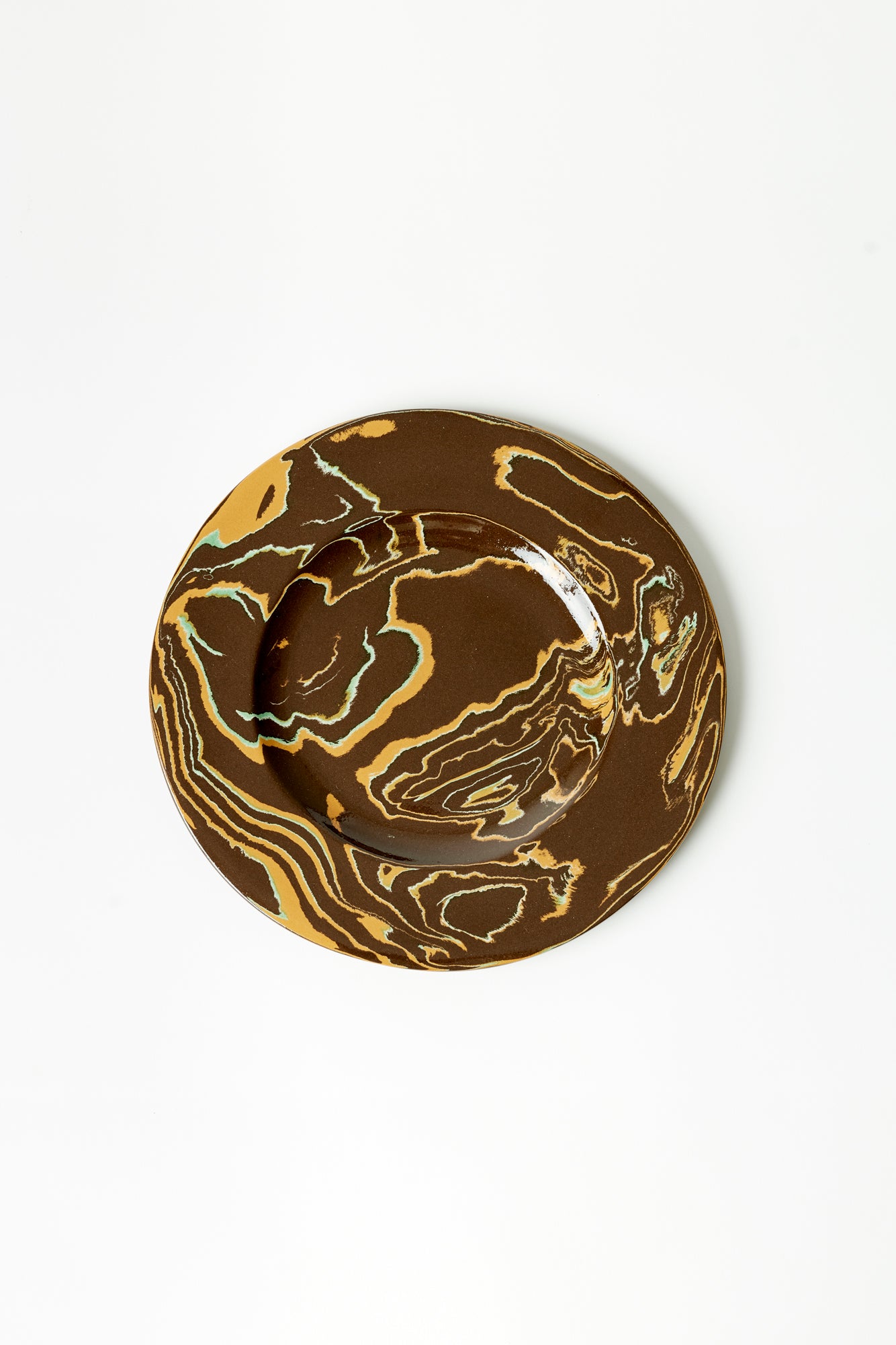 Brown and yellow marbled ceramic plate.