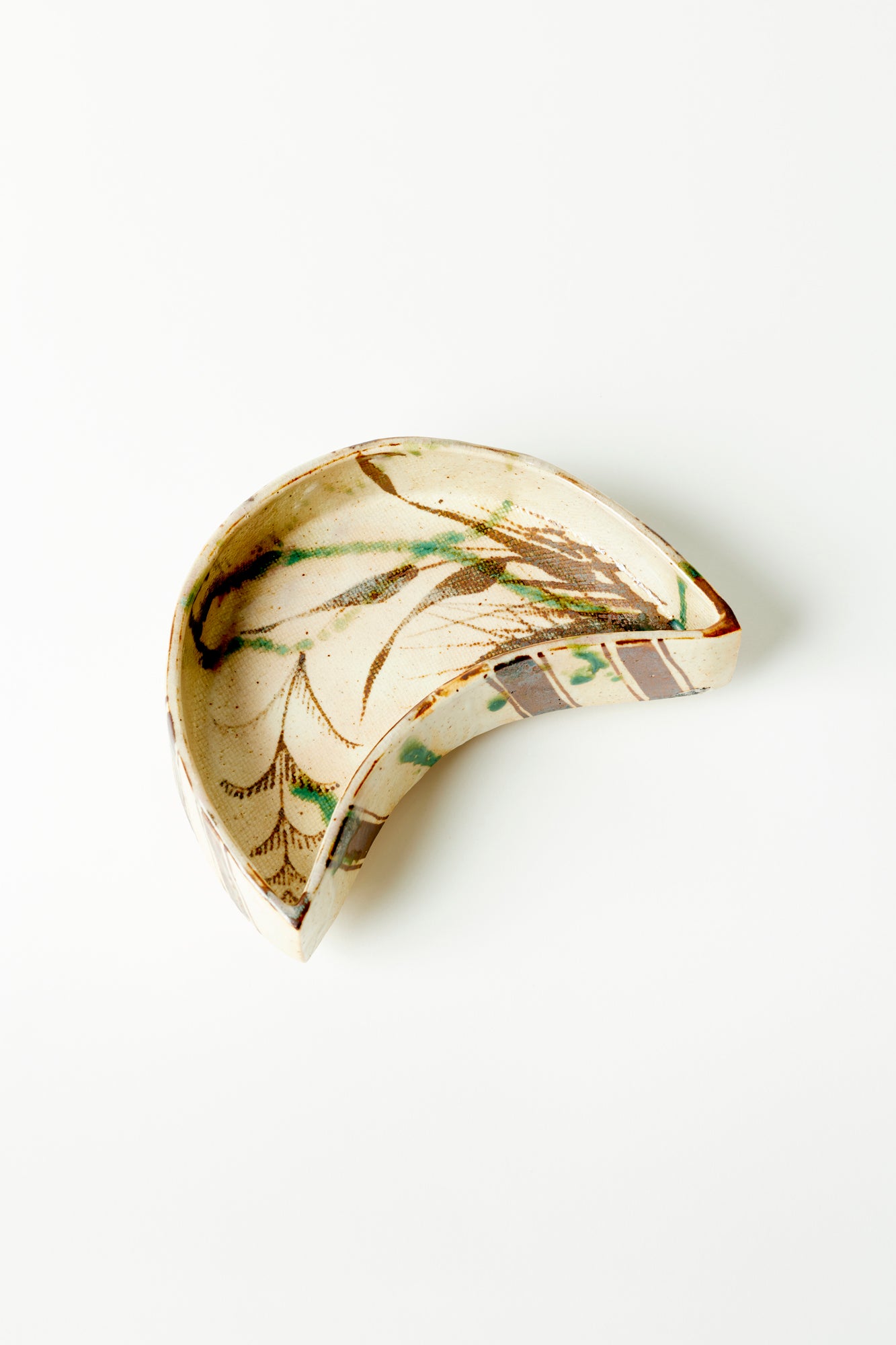 Japanese ceramic marbled crescent wedged serving dish.