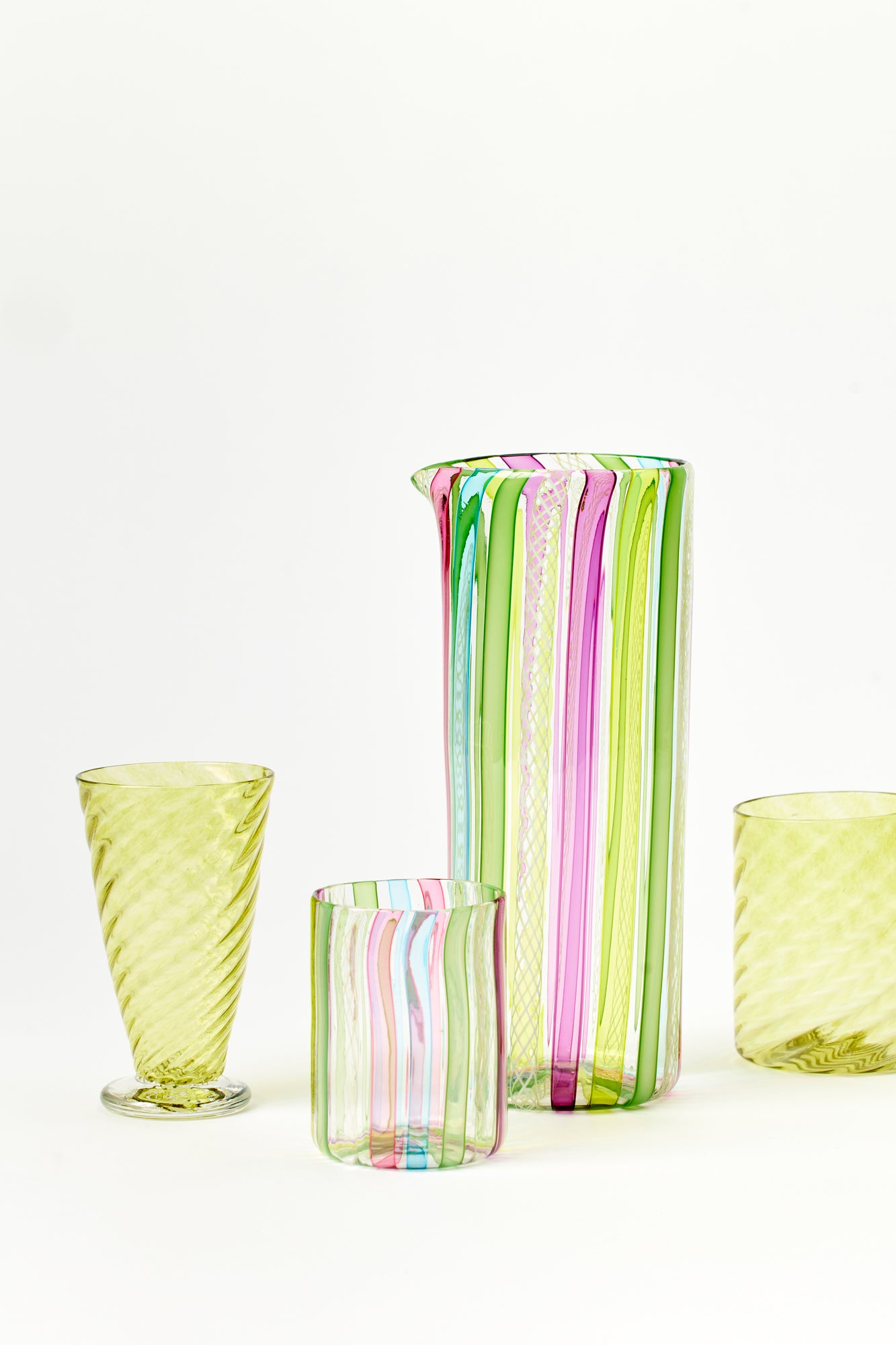 Latticino pitcher handblown using twisted glass canes by Tracy Glover.