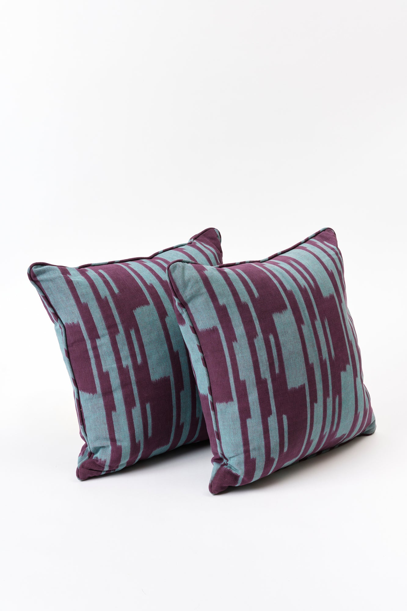 Pair of blue and purple pillows.