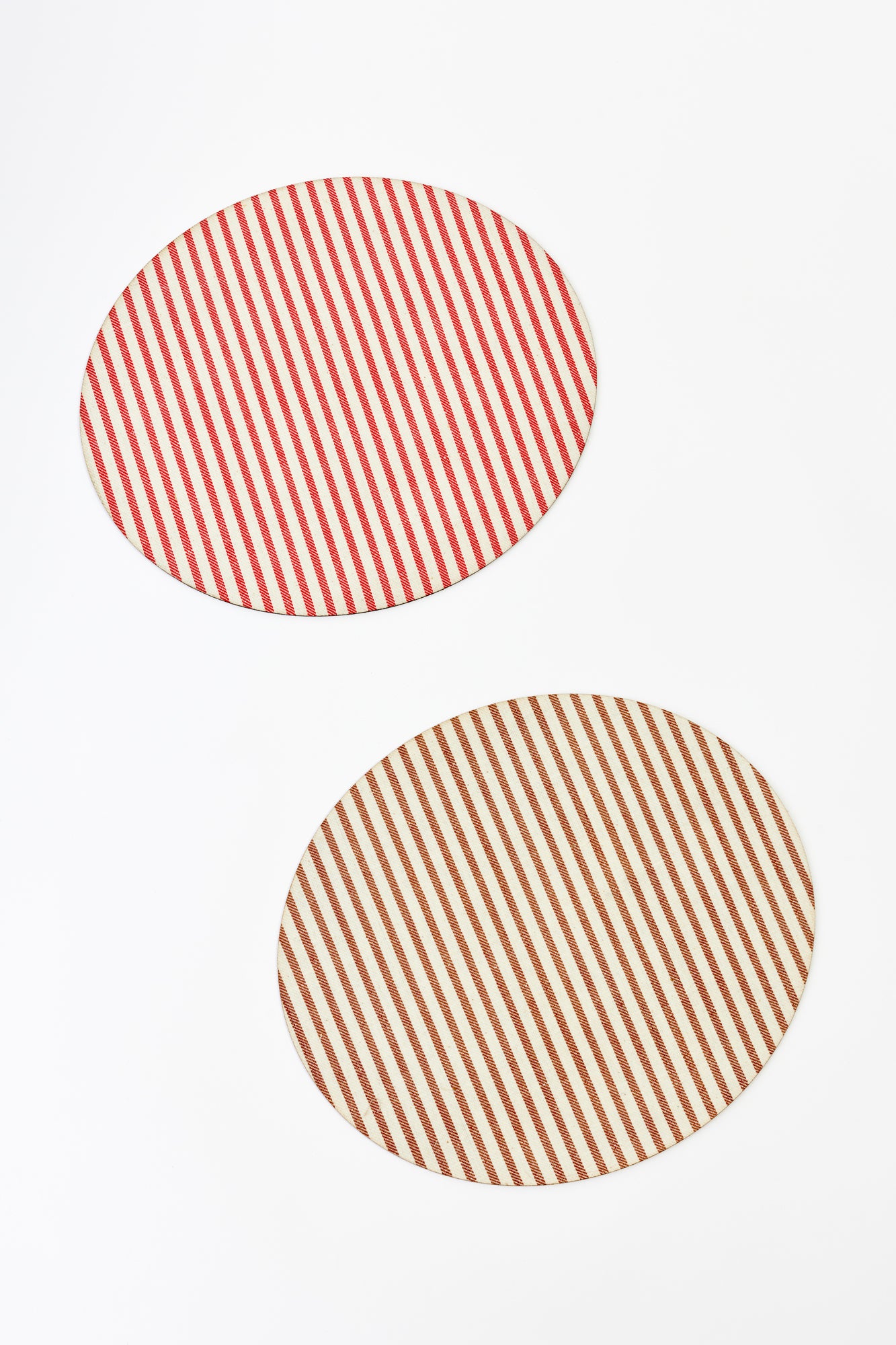 Round placemat with red and cream vertical stripes or chocolate and cream vertical stripes, adding a classic and elegant touch to any table setting.