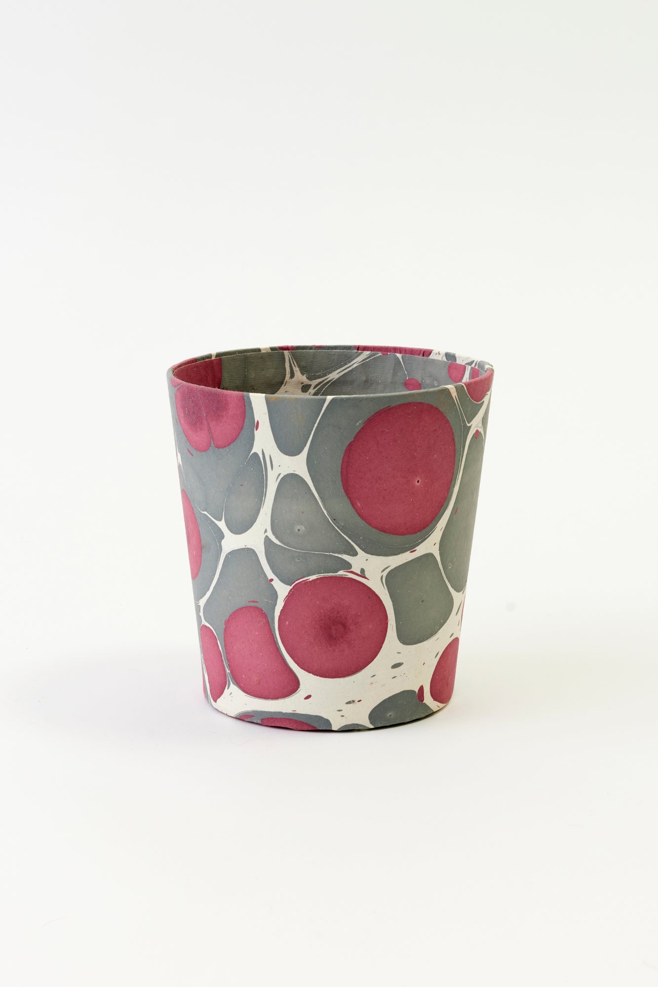 Artisan paper-covered cachepots with a plastic liner. Made to fit pots of standard seasonal bulbs or orchids.