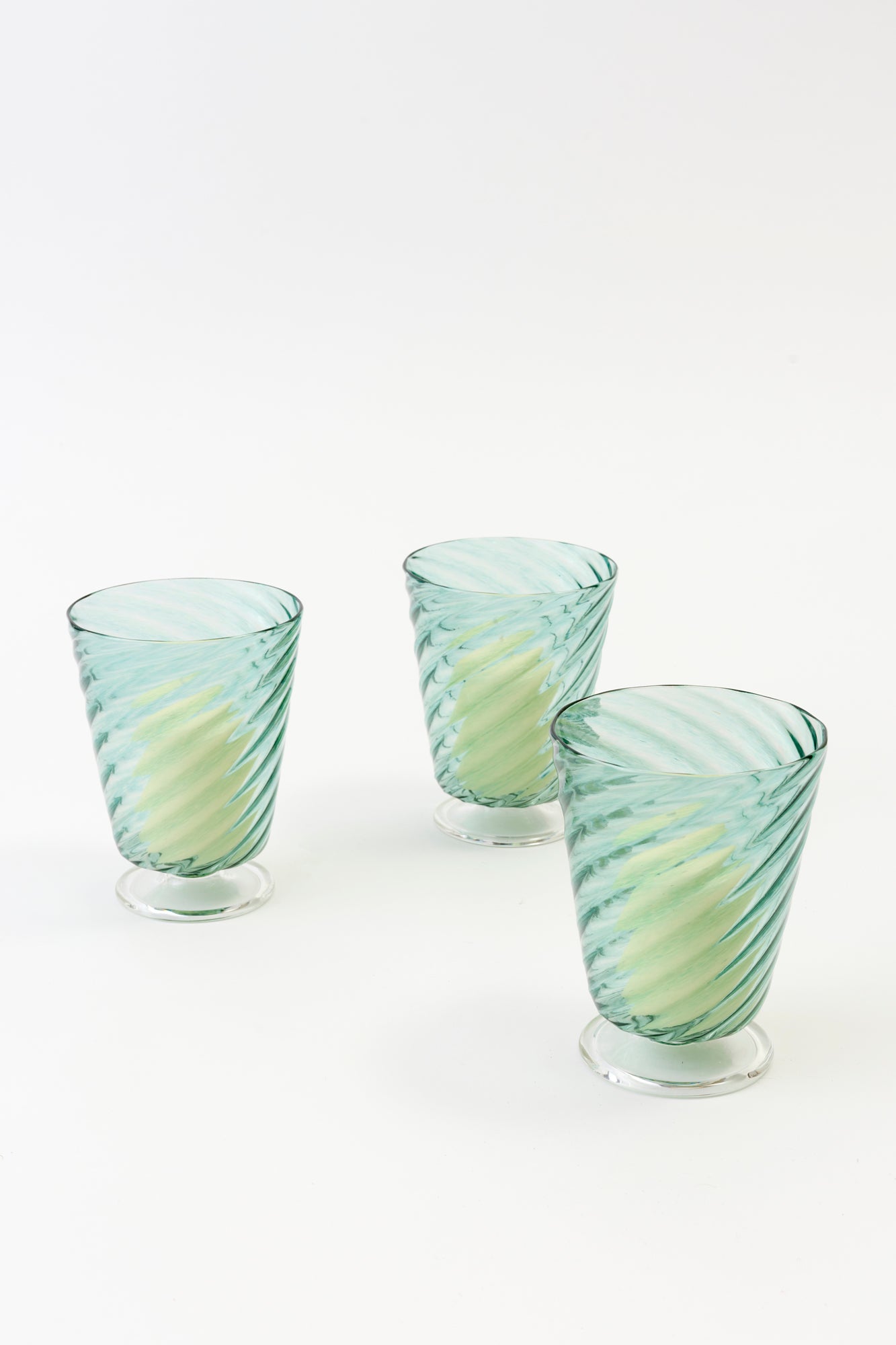 Turquoise glass twist hurricanes.