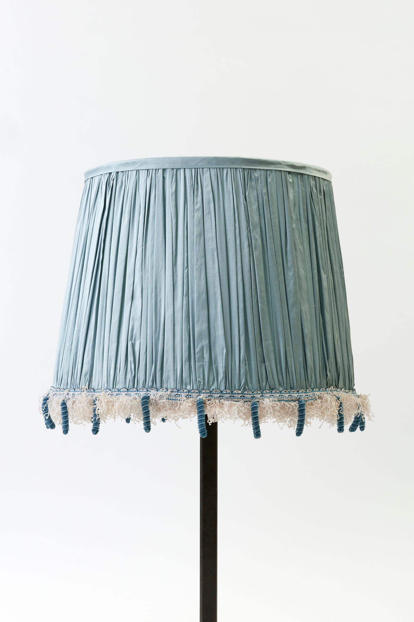 Shirred silk shade is trimmed with tassel fringe from Paris.