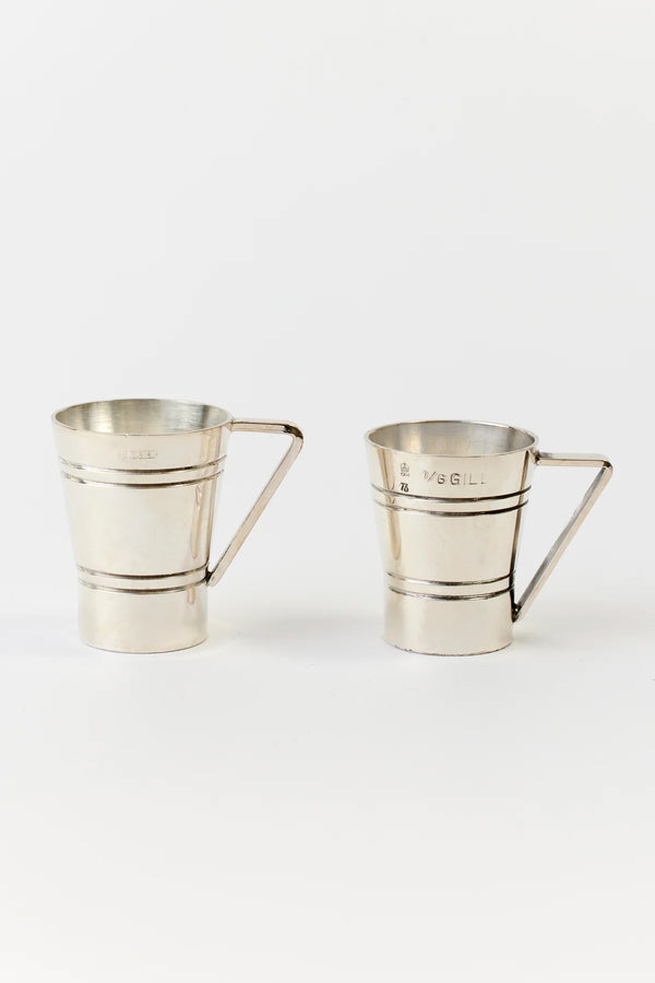 PAIR OF ENGLISH SILVER JIGGERS WITH HANDLES